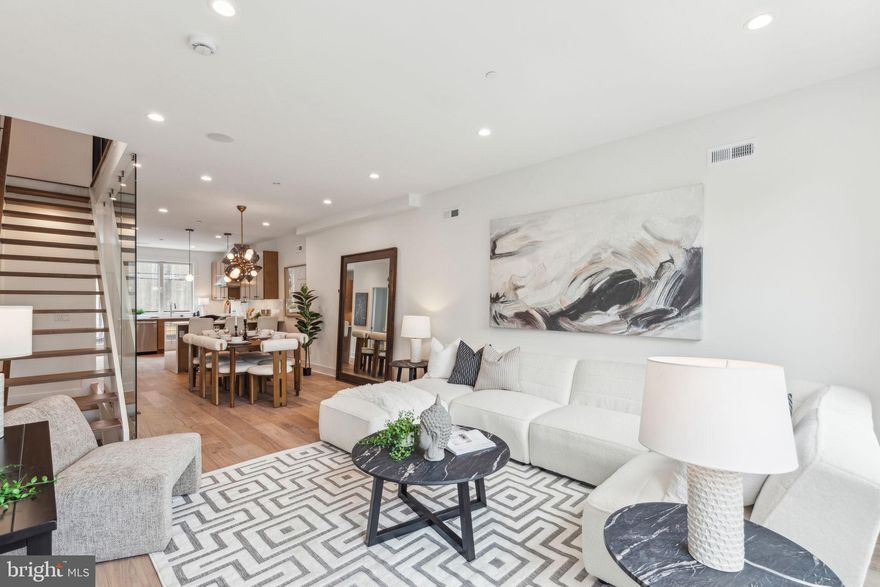 Welcome to Pine Vista! This gorgeous NEW CONSTRUCTION home, featuring 2,750 square feet of interior living space, offers a RARE LOCATION in desirable Fitler Square directly overlooking Schuylkill River Park. With 9 TO 10 FOOT CEILINGS throughout and exterior views unique for single-family homes, Pine Vista has it all.
From the chef's kitchen are two options: your expansive dining area and living room – or your private deck, the perfect space for a quiet outdoor meal. Back inside, head downstairs to the giant flex space which also opens to the expansive, private rear yard -- perfect for grilling and outdoor entertaining. The versatility of the flex space is yet another bonus and can be used as a home office, gym or even converted into a 4th bedroom! First floor also includes a CUSTOM BUILT MUDROOM upon entering the front door.
The third floor includes two large bedrooms with large closets which are equipped with custom shelving systems, two full bathrooms, and a full laundry room. The ENTIRE fourth-floor is dedicated to the main suite, which includes a custom walk-in closet, wet bar, as well as a private walk-out patio overlooking Schuylkill River Park with unobstructed skyline and river views. The massive roof deck offers unmatched panoramic views of the skyline and river! This house has an unheard of FOUR OUTDOOR SPACES to choose from on a beautiful day, not to mention the oversized windows throughout, which allow the entire home to be bathed in natural light! 
Located in the coveted GREENFIELD School Catchment. With a walk score of 90, you're steps away from everything: Schuylkill River Park/Trail/dog park, Rowhome Coffee, Cafe Lutecia, Rittenhouse Hardware, South Square Supermarket, Rittenhouse Square, shopping, and anything else you could ever want! Easy access to CHOP, Penn Med, and University of Pennsylvania, Drexel University, public transportation and 30th St Station. New construction in Fitler Square doesn't come around very often. Take advantage of this amazing opportunity to live in the heart of Fitler Square in a stunning new home! 10 year tax abatement approved.