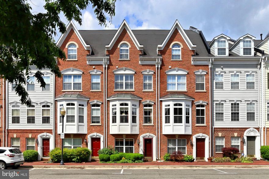 Indulge in luxury living with this exquisite four-level townhome nestled in Cameron Station. Situated on a tranquil street boasting ample visitor parking, this residence offers convenience and elegance at every turn. Step into the first level, where you're greeted by a versatile office space adorned with built-in shelving, accessible from both the garage and the front door.

Ascend to the main living area on the second level with gleaming hardwood floors throughout. Here, a spacious living room, adjacent dining area, and a gourmet kitchen beckon, complete with a cozy fireplace and ample space for dining. The kitchen boasts stainless steel appliances, granite countertops, and a delightful small deck, while expansive windows flood the space with natural light.

On the third level awaits a sumptuous owner's suite, featuring a luxurious master bath with a separate soaking tub and shower, as well as generous closet space.

The fourth level hosts a second bedroom with the potential for a third, offering flexibility and comfort. Residents can enjoy access to the community pool and fitness center nearby, while a one-car garage with storage and a carport for a second vehicle provide convenience.

For commuters, a free shuttle to the Van Dorn Metro station is available, ensuring stress-free travel. Situated on a quiet street just minutes from Old Town, this residence epitomizes sophisticated urban living, boasting two bedrooms, two and a half baths, and an unparalleled blend of style and functionality.