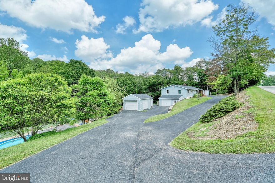 Love privacy and the outdoors? Then this is the property for you.  Well maintained rancher situated on 2.37 acres with oversized 2 car garage and 2 extra sheds.  Large deck overlooks rear of property to watch deer and other wildlife.  Large family room in basement with access to/from garage and walk out to rear of property.  In ground pool for summer entertainment and relaxation.