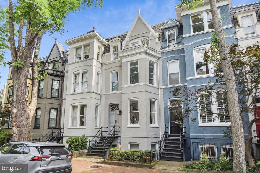 JUST LISTED! Fabulous 4-level Federal townhome with grand scale and PARKING in GEORGETOWN East Village location on a quiet street, yet surrounded by all that is Georgetown. This recently renovated home features 3 Bedrooms, 3.5 Bathrooms, including the Master Suite encompassing the entire second level, and two additional Bedroom Suites on the top floor - each with their own full baths. High ceilings and high-end finishes throughout: Waterworks fixtures, top-of-the-line Wolf, Sub-Zero, and Viking appliances including commercial grade gas range, and more. Walk-out to a private rear garden great for al fresco entertaining AND gated parking pad for 1 car!
