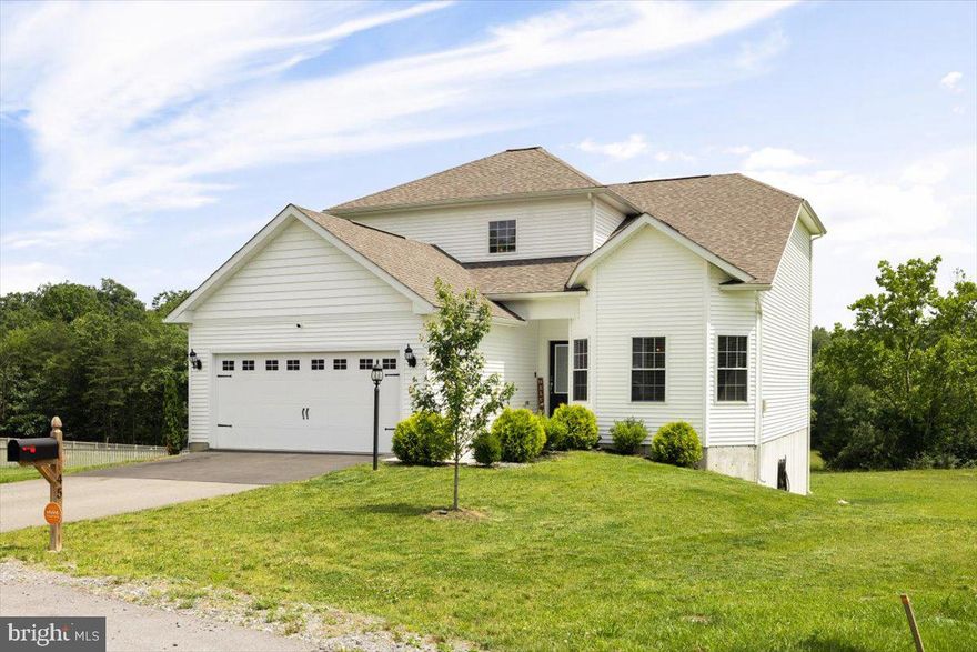 Welcome to Brookfield, where residents enjoy a 12-acre park, private boat ramp, and direct access to the Potomac River. This spacious, newly built home is a must-see, offering beautifully designed entertaining spaces and a modern floor plan with undeniable curb appeal. Highlights include a covered front entryway, elegant glass front door, and professionally landscaped front yard. The expansive first-floor primary suite is a true retreat, featuring a charming bay window, luxurious bathroom with a marble vanity, and an oversized walk-in closet. Upstairs, you’ll find three generously sized bedrooms and a full bath, ensuring ample space and comfort. Thoughtful designer upgrades elevate every corner of the home, including granite countertops, 36” upper wood cabinets with crown molding, a full suite of premium stainless steel appliances, and recessed lighting in the kitchen.