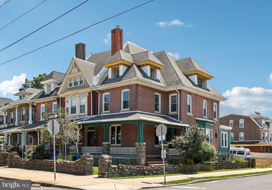 Timeless character and vintage charm define this beautifully maintained end-of-row home in the highly sought-after Northwood section of Philadelphia. From the inviting L-shaped covered porch to the private fenced backyard, this home exudes warmth and craftsmanship. Inside, you'll find an array of original features that reflect the quality of a bygone era—gorgeous stained glass accents, natural oak floors and millwork, solid oak pocket doors, high ceilings, and graceful curved staircases. With six spacious bedrooms and three full bathrooms—one on each level—this home offers impressive flexibility for modern living. The primary bedroom includes a walk-in wardrobe/dressing area, and there’s ample storage in the walk-up attic and full basement with exterior access. Off-street parking for two cars is an added bonus. Ideally located near public transit, two local parks, and just three blocks from Frankford Friends School, this is a rare opportunity to own a classic home rich in preserved architectural detail.
