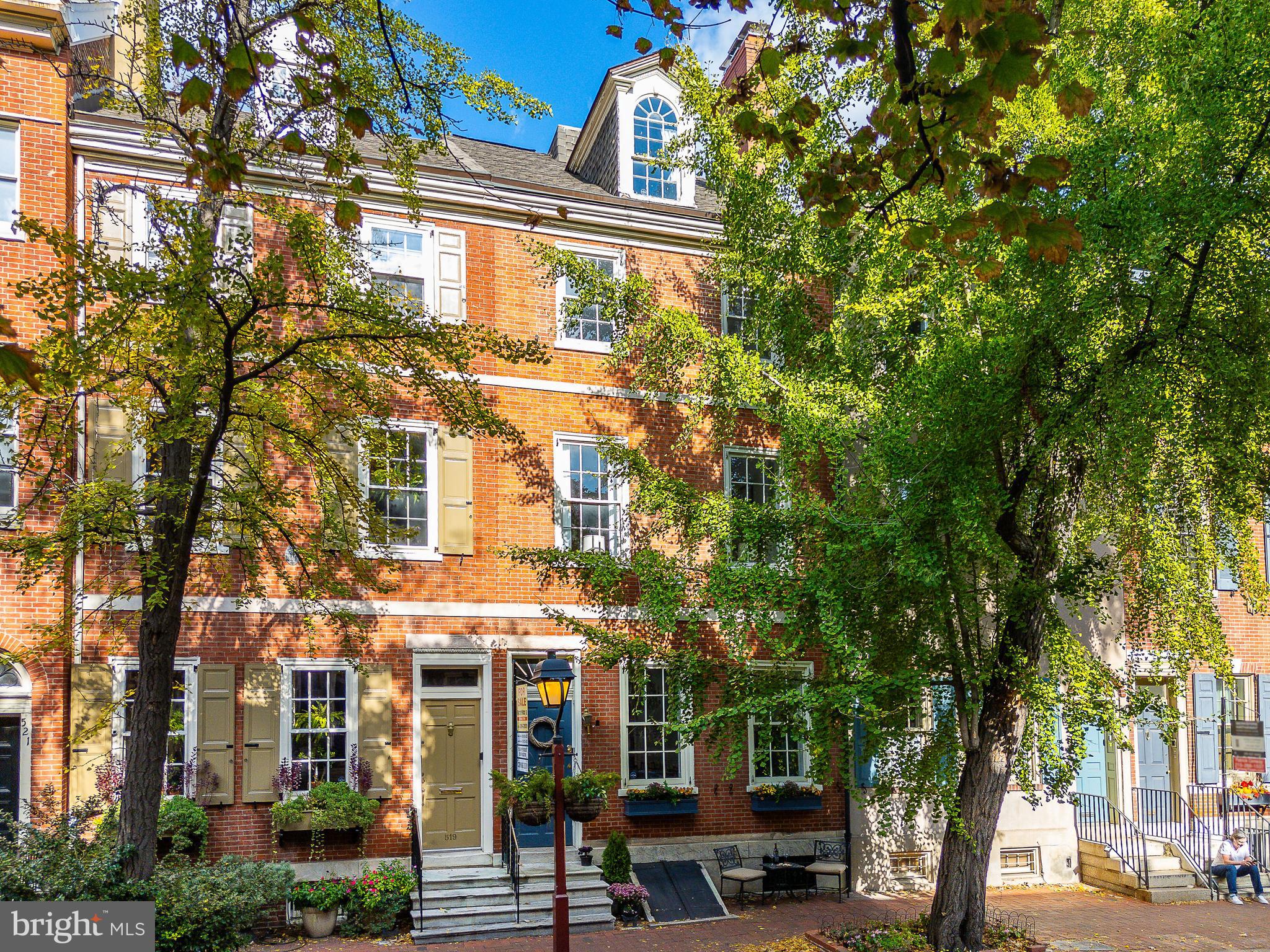 Step into history, and write your own, across the threshold of 517 Pine Street, in Philadelphia’s Society Hill Neighborhood. Yesterday meets today in this 6-bedroom, 4.5-bath residence. This house is beautifully situated on a picturesque tree-lined street and is listed on the Philadelphia Historic Registry. The current owner lovingly modernized their home, never sacrificing the period’s appeal.
As you enter, you're met by a stylish vestibule that leads to a foyer. Relax or cozy up with friends and family in the spacious Living Room, perhaps in front of one of the seven beautiful fireplaces. The Formal Dining Room is ideally suited for entertaining. This level provides an elegant half bath for your convenience.
You will find the stunning kitchen at the back of the house, well equipped with top-of-the-line Miele appliances, including a warming drawer and induction stove. The interior seamlessly flows onto an outdoor patio area, perfect for al fresco dining and friendly gatherings.
On the second floor, you'll discover the Library adorned with rich wood accents. There is a full hallway bathroom and a bedroom. The hallway delivers you to the Primary Bedroom with an en-suite bathroom.
The third floor boasts two generously sized bedrooms and a shared “Jack-and-Jill” bathroom. The fourth floor features 2 dormered bedrooms, one of which has a private bathroom.
The basement is currently unfinished but offers great potential. There is currently a wine storage area, perfect for any connoisseur.
***WE ARE OFFERING 1-YEAR PRE-PAID RESERVED FIRST-LEVEL GARAGE PARKING LESS THAN 2 BLOCKS AWAY*** SECOND TANDEM SPACE IS ALSO AVAILABLE***There is a waiting list for garage parking at this location but the space is TRANSFERABLE TO A NEW OWNER
You will be only steps away from Independence Park, Washington Square Park, fantastic restaurants and shops, and every other residential amenity. Don’t miss the opportunity to make this address your address. Schedule a showing today!