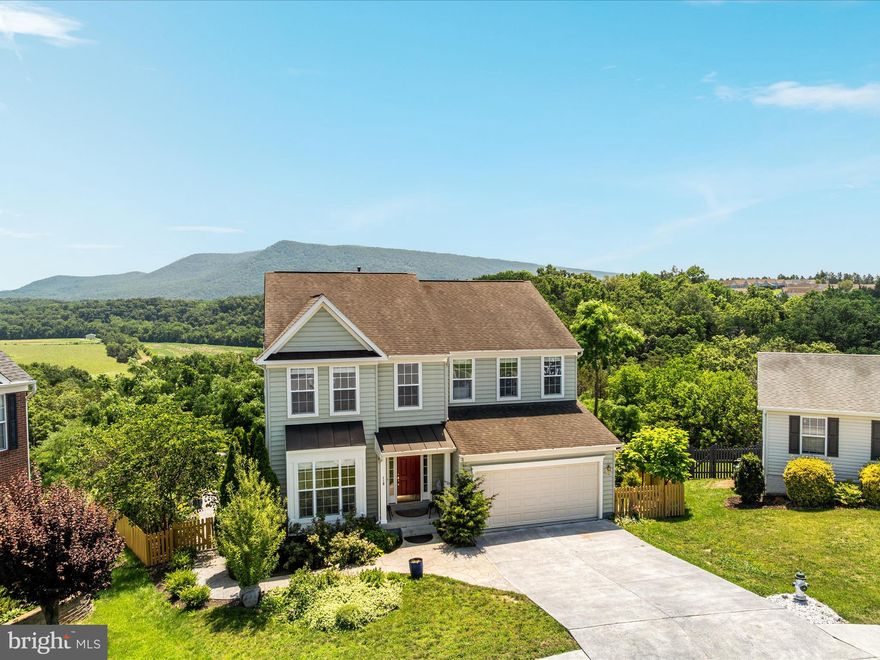 UNPARALLED PANORAMIC LONG-DISTANCE VIEWS! Rare opportunity in sought-after Oxbow Estates. Tranquil serenity is found in this 5 bedroom, 3.5 bath 3,400+ sq.ft, 3-level colonial-style home situated at the top of a cul-de-sac deep within the neighborhood. Start and end each day gazing at the sunrises and sunsets from the oversized South-facing deck and expansive patio. Enjoy to stunning unobstructed mountain views from the oversized windows in the formal dining room, kitchen, and family room. Entertain friends and family in the formal living room or step into the spacious family room open to the kitchen. On beautiful days and evenings, meander out to the deck and patio, easily accessible through the kitchen and family room. When the weather gets chilly, head in to the family room to gather around the gas fireplace. Prepare favorite meals in the kitchen with its gas cooktop, French door refrigerator, and abundant counter space all while still be part of the conversation with those in the adjacent breakfast room and family room. The upper level boasts a primary suite with a large en-suite bathroom including a deep soaking tub with mountain views, a glass-enclosed walk-in shower, and an extra-long double vanity. Three secondary bedrooms, two with stunning mountain views, a newly remodeled full bath, and a laundry room complete the upper level. The fully finished basement includes a large bedroom, newly remodeled full bath, and an expansive recreation room with walk-out access to the patio and back yard. Meticulously maintained, this home is fully move-in ready: baths remodeled (2025(; new refrigerator and kitchen countertops (2025); new hardwood floors on the main level, new carpet on the upper level, and new luxury vinyl plank in the basement (2025); whole home freshly repainted (2025); shed and cement pad (2022); patio and walkway (2021). Very conveniently located within minutes of Historic downtown Strasburg, I-81, and I-66.