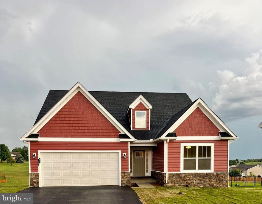 1.85 acre  lot with incredible mountains views- front & rear-!  4 bedroom/ 3 full bath rancher with bonus 2nd floor suite- 2 story cathedral ceilings in great room & foyer / stone water table front, upper level loft/ 4th bed room/ 3rd bath - 2nd HVAC ( 2 story foyer open rails at loft  ) -Tray ceiling in master with 2 piece crown - Chair rail and lower picture molding hallway/ foyer, lvp hardwood look flooring , Tile walls  master shower custom shaker kitchen cabinets with crown molding, whirlpool stainless steel appliance, oversized kitchen island, Quartz countertops - Amazing location- with in 5 minutes to the hospital and 81- Hedgesville School District.  THIS IS A CONSTRUCTION TO PERM.