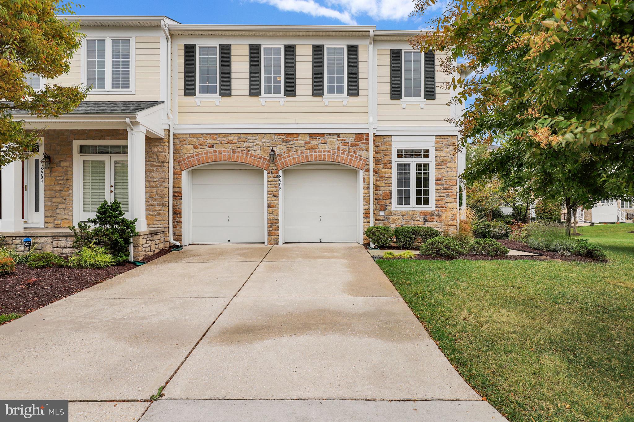 Welcome to this beautifully updated end-unit home filled with natural light and modern upgrades. A rare full 4-car driveway and grandfathered private patio with lush perimeter shrubs set it apart. Inside, enjoy an open and inviting layout with crown molding, a first-floor laundry, and a main-level bedroom suite. The kitchen shines with updated counters, backsplash, Bosch dishwasher, sink with touch faucet, and a newly added pantry/shelving system. Comfort extends throughout with three-plus bedrooms, three full and one half bath, each featuring comfort-height low-flow toilets. The second floor boasts Karastan carpeting, office/bedroom add on, and a spacious primary suite with spa like soaking tub and large closet. Recent upgrades include ceiling fans, and tinted west-facing windows, a new roof and gutters (2023), two new HVAC systems with hybrid heat pumps (2022), improved insulation, LED lighting, and freshly painted interiors. A solar array, EV charger, surge protector, and whole-house sound wiring provide efficiency and convenience. The fully finished basement offers even more space for living and entertaining, completing this exceptional home.