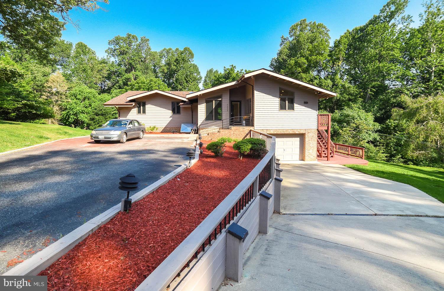 Don't miss your chance to become part of this exclusive established community of Scientist's Cliffs. The well-lit entrance to this secluded gem shows off plenty of room inside and out and offers a private beach for your pleasure. A large master with private bath and two large bedrooms are all on the main level. The family room opens to a screened porch that wraps around to the kitchen entrance. In the kitchen, there's room for plenty of family time in the eat-in area, which leads to a nice size dining room for more formal events. The nearly completely finished lower level features a wood stove and plenty of room for all of your hobbies, including a good size workshop. A separate laundry opens to a good size garage. Outdoor options include tennis, boating, swimming (in the Bay or a community pool) and a very quiet, but active neighborhood. New roof in 2019. Fresh paint throughout! HOME WARRANTY. (Closet doors are being refinished and will be reinstalled by closing!)