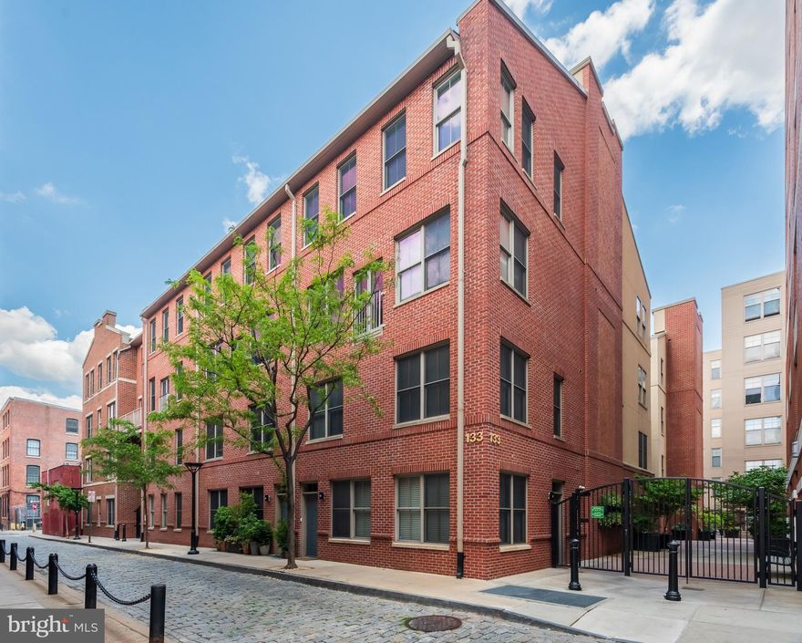 Welcome to 133 North Bread Street, Unit J3, a wonderful two story home in The National, one of historic Old City's most coveted addresses. A serene oasis set in the heart of one of Philadelphia’s most desirable neighborhoods. The best of city living plus a reserved, indoor parking space (spot # 125).  The main level offers an open concept living and dining area.  A gourmet kitchen features plenty of raised panel cabinet space,  a granite  backsplash, stainless steel appliances, granite countertops and a center island with pendant lighting. A perfectly situated powder room plus a laundry room/storage room/pantry complete the picture of this level of the home. The upper level is home to the owner's suite which features a nicely tiled en suite bathroom with double sink vanity and a huge walk-in closet with built -ins. A good sized second bedroom is serviced by a second full bathroom and also offers a large walk-in closet. Hardwood floors, great closet space, ceiling fans, a dedicated parking space and much more all come together to make this a very special place to call home.  The National is a coveted gated community offering elevators, an inner courtyard, a tot lot and underground parking. Close to historic Elfreth’s Alley, Morgan’s Pier, the National Constitution Center & Liberty Bell and the fabulous shops and restaurants of Old City. This is a wonderful home in a prime location offering the absolute best in city living. A rare opportunity to live in a quiet home just steps to a vibrant neighborhood. This is the one. Welcome home.