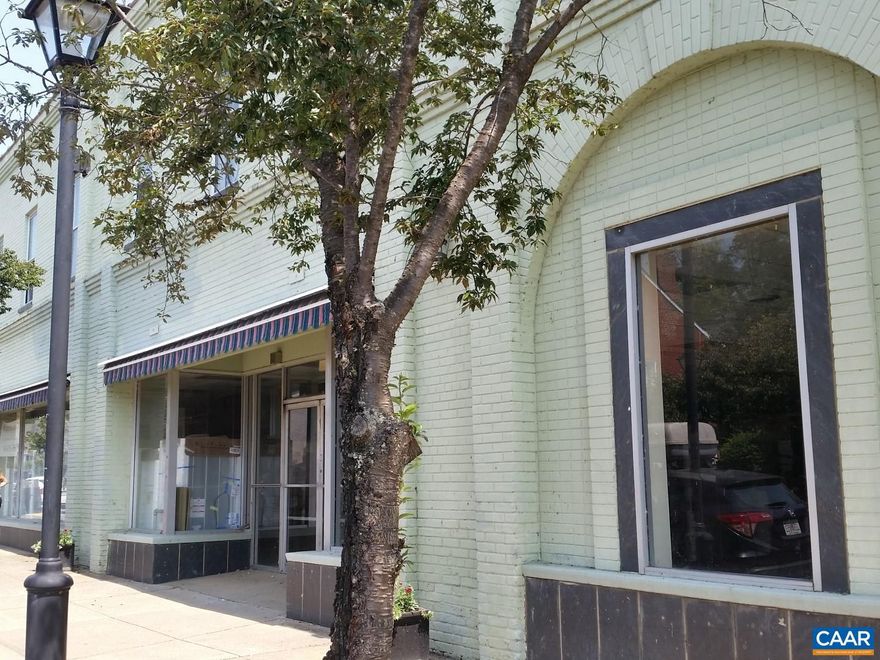Premier location in downtown Scottsville: 135 feet of store-frontage on Valley Street. Built in 1920, this is a mixed-use building with three apartments on the second floor and presently two separate store fronts. With over 13,000 square feet combined, this is one of the largest buildings in the downtown of Scottsville, and truly the town's centerpiece.