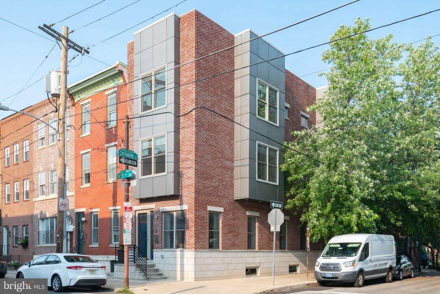 Pristine newer construction corner town home with 2-Car Parking in the Meredith School CATCHMENT. This gorgeous 4 bedroom, 4.5 bath home offers three exposures for spectacular light. All-day sun from the east and west and the entire side of the home is on the southern face. Panoramic roof deck with Center City skyline and bridge views, finished lower level with high ceilings and natural light houses the fourth bedroom and a full bath. Perfect for a family room/playroom/guest room/office or as a full time spacious bedroom suite. High ceilings throughout. Hardwood floors throughout. Really large rooms and spaces throughout. Open first floor plan with beautiful and spacious kitchen. Lovely baths. 2-zone HVAC, An amazing home on a stellar, neighborly block in the Meredith School Catchment. 2-car parking. 99 WalkScore—close to parks, Weccacoe Playground (on this block!), restaurants, coffee shops, and all that Queen Village and Center City have to offer.