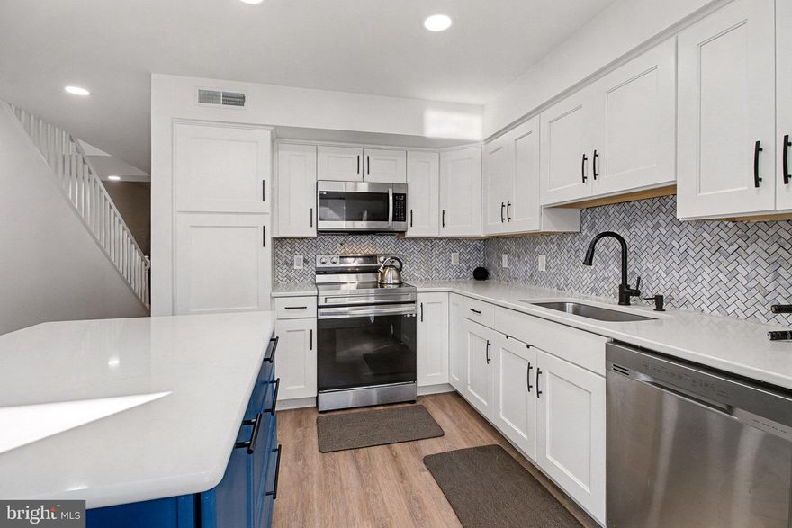 Exceptional condition and truly move-in ready, this contemporary and economical townhome in Petersburg Commons offers comfort, style, and low-maintenance living. The main level features an open combination kitchen and dining area with a brand new island that conveys, quartz countertops, farmhouse sink, custom backsplash. Stainless steel appliances include a built-in microwave, stove, refrigerator, and dishwasher.

Recent laminate flooring installed in 2022 runs throughout the entire home. The main level also includes a convenient half bath with laundry. Upstairs offers three bedrooms and a full bath.  Skylights that fill the space with natural light.  New windows 2022.

Step outside to enjoy extensive high-end landscaping, a completely fenced yard, electric awning, firepit, and outdoor storage. Two paved parking spaces are located directly in front of the home. The property is situated on a cul-de-sac with low HOA fees of just $15 per month.

Located near Routes 322 and 11/15, this home offers easy access for commuting while maintaining a quiet neighborhood setting. With potential 100% financing options available, this is a package that is hard to beat. Move right in and enjoy maintenance-free living. Schedule your private tour today and start your next chapter here.