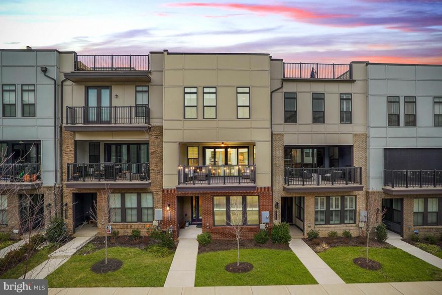This BEAUTIFUL Van Metre Teagarden model is perfectly located in downtown Brambleton, offering true walkability to the Town Center, shops, restaurants, theater, and library. Enjoy the Brambleton lifestyle with nearby parks, playgrounds, and splash pads at Hal and Berni Park.

Offering 4 bedrooms, 3.5 baths, a 2-car garage, and over 2,836 sqft, this home features a first-floor bedroom with full bath—ideal for guests or a home office. The open-concept main level showcases a gourmet kitchen with a large quartz island, high-end stainless steel appliances, and abundant cabinetry. The family room opens to a large balcony with an automatic screen overlooking the promenade.

Upstairs includes a spacious primary suite with walk-in closet, two additional bedrooms, and a hall bath. Less than 10 minutes to Ashburn Metro station—this home blends modern living with unbeatable convenience.