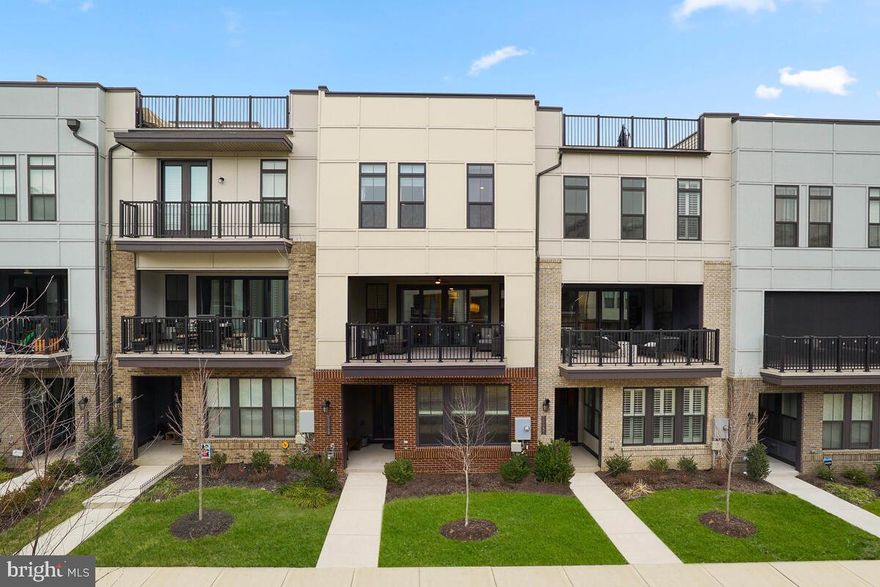 This BEAUTIFUL Van Metre Teagarden model is perfectly located in downtown Brambleton, offering true walkability to the Town Center, shops, restaurants, theater, and library. Enjoy the Brambleton lifestyle with nearby parks, playgrounds, and splash pads at Hal and Berni Park.

Offering 4 bedrooms, 3.5 baths, a 2-car garage, and over 2,836 sqft, this home features a first-floor bedroom with full bath—ideal for guests or a home office. The open-concept main level showcases a gourmet kitchen with a large quartz island, high-end stainless steel appliances, and abundant cabinetry. The family room opens to a large balcony with an automatic screen overlooking the promenade.

Upstairs includes a spacious primary suite with walk-in closet, two additional bedrooms, and a hall bath. Less than 10 minutes to Ashburn Metro station—this home blends modern living with unbeatable convenience.