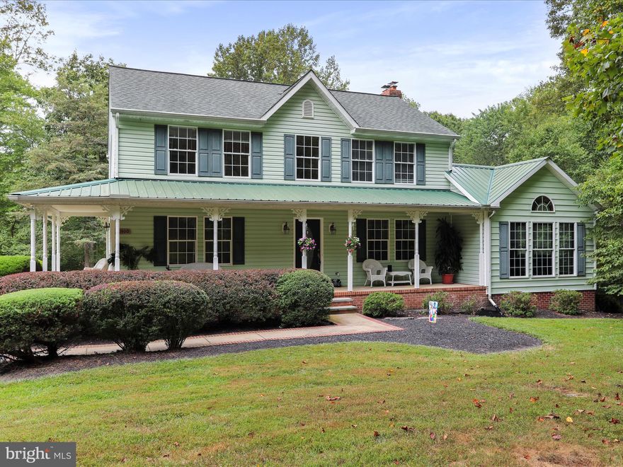 Tucked away on over 12.5 secluded acres, this one-of-a-kind Colonial offers the perfect blend of privacy, nature, and versatile living ideal for outdoor enthusiasts, hobbyists, or anyone looking for a private retreat. Inside, you’ll find 3 spacious bedrooms, 3.5 baths, and a bright, open layout. The sunroom with vaulted ceilings and wood floors offers a peaceful space to relax and soak in the panoramic views. The large kitchen flows seamlessly into the living, dining, and family room complete with a cozy fireplace and warm wood accents throughout. The partially finished basement includes a full bath, wood stove, and walkout access—great for guests, recreation, or creating the ultimate home gym or workshop. Car enthusiasts will love the 28x50 detached garage with 2+ garage bays, a car lift, tire machine, and air compressor all included. There is also a 30x50 Morton building offering plenty of storage. Outdoors, enjoy a heated in-ground pool, stocked pond with fountain, picnic area, firepit and miles of access paths perfect for hunting, fishing, or simply escaping into nature. No HOA, no restrictions—just pure freedom. Located minutes from state parks and Route 15, this is your chance to own a private sanctuary with all the comforts of home.