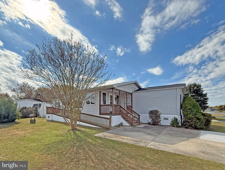 Sussex East/West is a leased-land, 55-plus* community (*up to 20% of owners may be younger than 55-years-old).  Sussex East is located approximately 5.5 miles from the Lewes public beach, with the Cape Henlopen State Park beaches...and the famous Rehoboth Beach boardwalk not much farther away.  This community has a unique location with direct access to the State Park’s hiking/biking trail through common grounds!  This spacious 14’x70’ singlewide features a 11’x20’ enclosed porch with vaulted ceilings. There’s a covered front porch, and there is an 11’x10’ open, rear deck that leads down to the patio and storage shed. The home’s living room, which has a coat closet, opens to the eat-in kitchen. Appliances include a fridge, dishwasher, gas range, and a built-in microwave. The hall laundry has a full-size, side-by-side washer & dryer set. Popular split bedroom plan. The main bedroom is at the rear of the house, and it has a double closet. The first full bath is just outside of the main bedroom, and it features a step-in shower. The other two bedrooms are near the second full bath, which also has a step-in shower. Natural gas. Gas force air heat, central AC & a portable AC unit for the sunroom. Storage shed. Being offered AS IS - needs a bit of TLC. Two pets are allowed in Sussex East, and they have a fenced dog park near the community’s indoor salt-water pool. (Note: Family & friends may always visit, but rentals and subletting are NOT permitted in this community). Leasehold interest: Current Lot Rent of $1,003/mt. (Lease will renew again on June 1, 2026 with any increase capped as per 25 Del. C. Sec. 7050-7054). Homeowner pays electric, water, sewer, fuel (metered natural gas), recycling & lawn maintenance. RHP, the community owner, requires an Application from the Buyer, with acceptance based on the following criteria: 1.)income verification, 2.)favorable credit bureau score, including evaluation of debt-to-income ratio, and 3.)clean criminal background check. Financing may be available to qualified borrowers from only a few Lenders that specialize in installment/chattel loans for manufactured homes on leased land. Closing costs will include a 3.75% transfer tax (DMV Doc Fee) & a Settlement Agent fee.