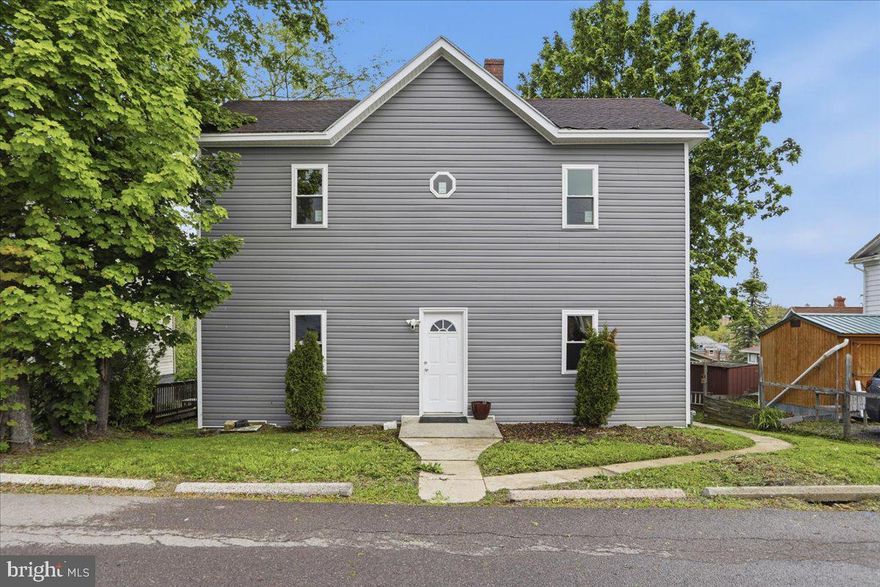 This large home across from the Frostburg State University campus just had a new and beautiful face lift to include all new siding, all new windows throughout, new water line into the home and an updated bathroom!  Along with all of the wonderful upgrades this home also offers a large eat in kitchen, large living room and 4 large bedrooms, to include one on the main level.  Within walking distance to the Frostburg campus and downtown Frostburg where you will find great shopping and restaurants.  Don't miss out on this newly update home that is priced to sell!!  When showing the home please park in the rear yard which is accessed by the alley.  Professional photos coming soon!!