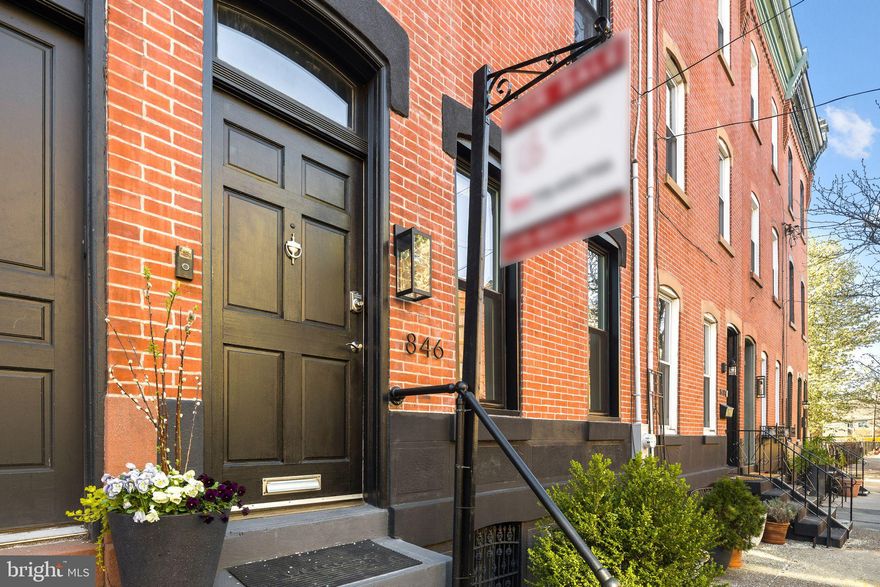 Walk into this beautifully renovated 4-bedroom, 2 1/2-bath Fairmount home featuring a finished basement, stunning west-facing roof deck, custom laundry room, and a one-of-a-kind outdoor chef’s kitchen complete with a wood-fired pizza oven. 

The interior of this Fairmount gem shines with contemporary upgrades as well as original, architectural grace. Millwork in the front vestibule entry, window trim, stairwell and other moldings maintain this 1920 home’s historical integrity.  Its wide-open first floor features 21st century wood flooring extending through the living and dining areas. The kitchen offers Carrara marble countertops with contrasting backsplash, a breakfast bar, and all new or recent stainless steel, Viking appliances. Beyond the kitchen, discover a versatile mudroom equipped with a full-size washer/dryer, custom floor to ceiling cabinetry, and a convenient half-bath. 
Upstairs are two large bedrooms that share a hall bath and a smaller bedroom or office. The finished basement holds a TV and casual dining area, as well as plenty of space for storage. The third level has a main bedroom suite with large, luxury bath featuring a skylight, shower for two, and entrance to a stunning roof deck.

A 2014 renovation took the house down to the studs, creating its finished basement and ensuite third floor. Upgrades completed between 2020 and 2023 include: the installation of a living room gas fireplace built out with marble tile in minimalist design; renovated back patio with slate flagstone floor and rebuilt walls and doors; a first floor, outdoor chef’s kitchen and dining area, including a hand-built, wood-fired pizza oven, three professional-grade gas burners, sink, prep table, and refrigerator; remodeled master bathroom; laundry area cabinets and countertops; and a large roof deck made of Tech composite material that faces west with unobstructed sunset views.

This Fairmount-area street is filled with wonderful people, block parties, dinners with neighbors, and a shared appreciation for the magic of Art Museum Area living.  846 N. 24th Street is just blocks from Fairmount Avenue, Parkway museums, coffee shops, restaurants and a short drive or healthy walk to Whole Foods.

Ask about free parking option nearby!