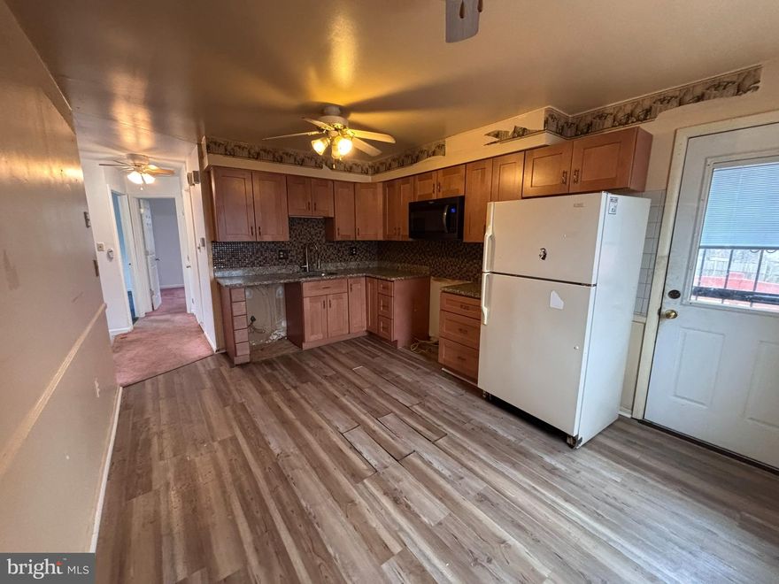 Welcome to this Classic Two-Level Colonial Offering Exceptional Space, Comfort, and Potential. Inside, You’ll Find Generously Sized Bedrooms,  Bright and Functional Kitchen with Granite Countertops, Tile Backsplash, and a Traditional Floor Plan Ready for Your Personal Cosmetic Touches and Updates. Step Outside to Enjoy Multiple Outdoor Living Spaces, Including a Spacious Deck, Rear Patio, and a Fully Fenced Backyard, Perfect for Entertaining, Gardening, or Pets. A Large Driveway Provides Ample Parking for Residents and Guests. With Solid Bones and Endless Possibilities, this Home Presents an Outstanding Opportunity to Customize and Build Equity in a Sought-After Location. Don’t Miss Your Chance to Make It Your Own!  Sold As-Is.