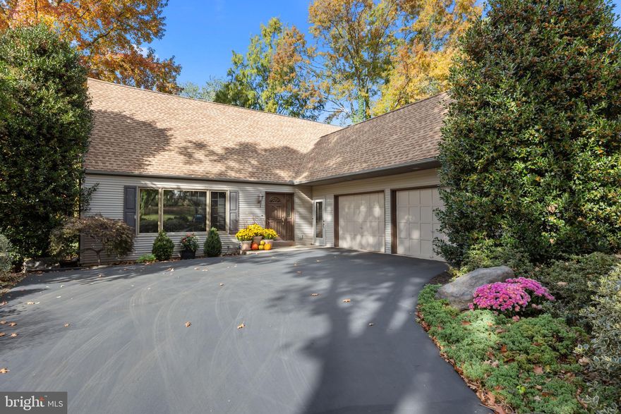 Welcome to this immaculate, spacious 4-bedroom residence located in the highly sought-after Carriage Hill community, situated on one of the neighborhood's finest lots. The entryway leads into the main living areas and key utility spaces. The large formal living room offers a sophisticated setting for entertaining and relaxation alike.  Sunlight pours through large windows, accentuating a warm, inviting ambiance. The elegant dining room is highlighted by large sliding doors that open to the patio, making it perfect for indoor-outdoor dining. A large, updated eat-in kitchen features rich wood cabinetry extending to the ceiling, Cambria Quartz countertops with Corian backsplash and a large stainless steel Electrolux refrigerator alongside a large Electrolux freezer plus other stainless steel appliances. There is a convenient back door off the kitchen leading to the patio.  The oversized family room is centered around a charming wood-burning fireplace flanked by built-in bookshelves and cabinetry plus an inviting, bright sunroom area which offers an abundance of windows and a lovely view of the backyard. Also on the main level is a bedroom, currently being used as an office, featuring a closet and large windows with an adjacent full bathroom. The laundry room includes an exterior door leading to the front of the house, serving as a functional mudroom entrance. The carpeted staircase with a wood railing leads up from the family room to the spacious second-floor hallway. The primary bedroom is generously sized and features plush carpeting, walk-in closet, a dedicated dressing area with a built-in vanity and excellent natural light from windows. The primary bathroom ensuite has a glass-enclosed, full-sized shower stall and a wide vanity with sink and a window which overlooks the beautiful backyard. Two well appointed additional bedrooms on this level are large with ample closet space and share a full hall bath with stylish tiled walls and a modern vanity with Corian sink top.  A very large basement area (30 x 50) features a painted concrete floor and a high ceiling with exposed beams. Peace of mind is provided by well-maintained mechanicals, including a gas-fired Weil-McLain Gold heater/boiler, a newer Bradford White water heater, a water softener system and a sump pump. The two car garage with interior access features an additional bump-out area, providing extra space. Enjoy outdoor entertaining on the patio and the privacy of a fully landscaped backyard plus a separate deck area featuring a hot tub. The property is equipped with a whole-house generator ensuring comfort and security regardless of the weather. Walk down to Silver Lake and enjoy seeing neighbors or perhaps wildlife. Continue on a short distance and come to the Yardley golf course, the train station and the south end of Yardley borough main street. From back at the house, walk just two blocks to Edgewood Elementary school and just beyond that the Township playground, tennis courts, pool and ball fields. The Bucks County Library is also there. This home site is among the finest within Carriage Hill. Its extra depth with a total of 259' gives an oversized rear yard with a pleasant, private view of mature trees and historic neighboring properties. Schedule your private showing today!