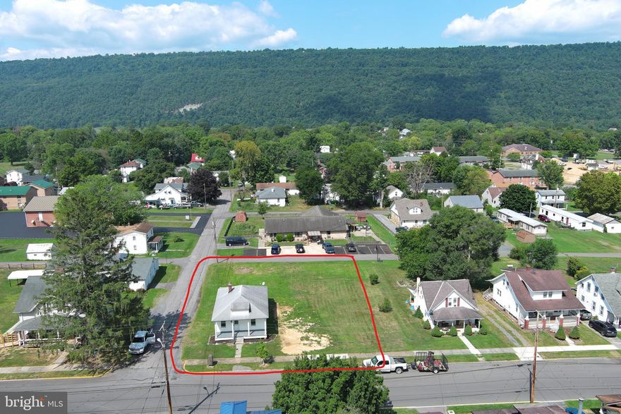 CHEAPER THAN RENT......BASIC BUNGALOW ON NICE DOUBLE LOT IN HISTORIC ROMNEY....NO FRILLS, NOTHING FANCY.....JUST THE BASICS, 3 BED, 1 BATH BUT IT'S SOLID AND HAS STOOD THE TEST OF TIME. ORIGINAL HARDWOOD FLOORS AND LAMINATE THROUGHOUT, PARTIAL BASEMENT AND ELECTRIC BASEBOARD HEAT....NOT MANY MOVING PARTS, SO THERE'S LESS THAT CAN GO WRONG. BUILD ANOTHER HOUSE OR GARAGE ON THE EXTRA LOT OR SELL IT IF YOU DON'T NEED IT....SHORT WALK TO BRAND NEW ELEMENTARY SCHOOL THAT'S UNDER CONSTRUCTION. IF YOU'RE LOOKING FOR A STARTER HOME OR LOOKING TO DOWNSIZE AND KEEP LIFE SIMPLE, THIS ONE FITS THE BILL. WHY WASTE MONEY ON RENT WHEN YOU CAN OWN FOR THE SAME MONTHLY PRICE