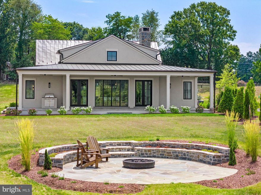 New price reduction and the best deal in Salamander! Welcome to your new home in Middleburg located within the "Residences at Salamander." Enjoy over $400,000 of upgrades including a premium lot overlooking the ponds, poured concrete basement, customized fixtures, added trusses, beams and ship-lap, additional cabinetry, built-ins, custom wallpaper and so much more! This section known as “The Vineyards” is sited within the 340-acres of the Forbes 5-Star Salamander Resort nestled in the heart of Virginia horse and hunt country. This move-in ready high-grade "Hunt Box" offers comfortable, yet elegant living spaces with the desired main level bedroom, an open kitchen and living room areas with a fireplace, along with an expansive covered rear porch providing wonderful light and views. This home offers modern conveniences along with a mix of traditional style to include oak floors, Quartzite countertops, luxury plumbing and lighting fixtures as well as floor to ceiling windows and doors. The chef’s kitchen offers high-end appliances such as a 48” Wolf stove, Cove dishwasher and Sub-Zero refrigerator in addition to upgraded custom cabinetry. Other features include the large mudroom/laundry area ideally located off the side parking area. The primary bedroom has a spacious primary bath with his & her vanities, a separate water closet and unique walk-through shower that leads to a private nook for the soaking tub. Completing this suite is a large walk-in closet. A powder room and another guest bedroom with a full bath round out this level. Wide stairs lead down to a finished foyer that accesses the full lower level. Close to 2,000 sq ft of conditioned space, this area is framed and plumbed but unfinished. It has space for two more guest bedrooms, two full baths, a spacious family room, utilities, storage, and a possible exercise room. This premium parcel is located on a ridge that provides outstanding views over the ponds as well as views of the Salamander barn and paddocks. Watch horses graze in the pastures while you sit at your custom designed private stone fire pit already plumbed with gas. Entertain on the 14’ wide by 53’ long rear covered porch with built-in gas grill and space for both a seating area and dining table. Join this community of exquisite homes and take pleasure in exclusive Salamander Resort amenities some of which include use of the indoor/outdoor pools, tennis courts, zip line course, putting green, spa and more. Also receive special invitations to private Salamander events. Enjoy the convenience of walking into town to experience the local restaurants, shopping, and local events. Don’t miss this opportunity to have a move-in ready home with so many extra benefits within historic village of Middleburg. Be sure to check out the video!