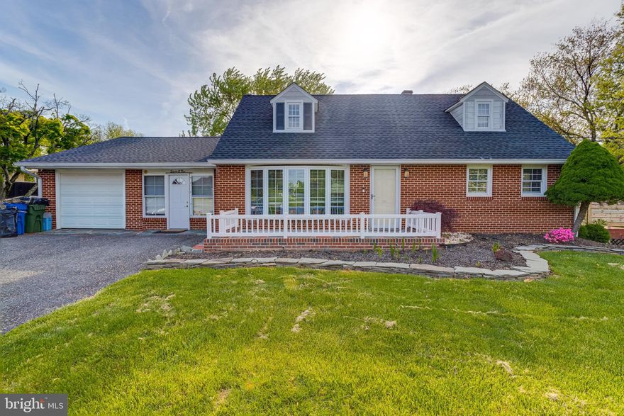 Welcome to this 4 bedroom, 2 full bath with a large fenced yard in Havre De Grace.  This brick cape cod sits on just a half a cleared acre and sits in a country setting just minutes from I-95 and downtown Havre De Grace.  Pull into the large driveway or into the one car garage.  Take the walkway to the front door which enters into the main level.  This floor has wood flooring throughout, a laving room with large front bay windows, and an open concept floor plan looks right over the newly remodeled modern chefs kitchen.  Counters and large island with breakfast bar are granite.  There is a cooktop in the island and double wall ovens, tons of custom white cabinetry and stainless appliances.  There is room for casual dining room, and beyond that are French doors that open onto the large wood rear deck.  This deck looks over and walks down to the large fully fenced grassy backyard.  Back inside a door of off the dining area leads out into a finished living area with fireplace that then leads into the garage.  Also on the main level are two bedrooms and a full bath with tub/shower combo.  Upstairs are two more bedrooms with a full bath.  Taking the stairs to the basement leads to a large unfinished area which can easily be finished to allow more living room.  The basement has been waterproofed, has full laundry facilities and a walkout into the rear yard.  This home is move in ready and waiting for you!