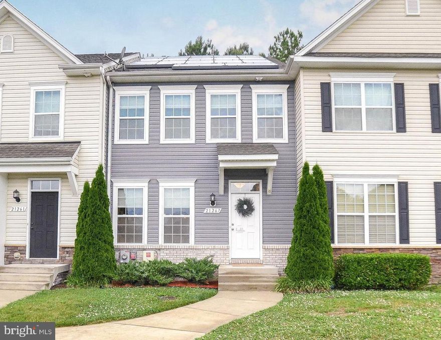 A real beauty chock-full of upgrades! Located in desirable Elizabeth Hills, this 3 bedroom, 3.5 bath, town home has so much to offer.  Hardwood flooring greets you on the main floor and leads to a kitchen that wows with granite counters, white cabinets, stainless appliances, island w/breakfast bar, recessed lighting, pantry, dove-tail drawers and eating nook. Dining room is dressed up with crown molding, chair rail and shadow box wainscoting.  Comfy living room features ceiling fan, cordless blinds and sliders out to a composite deck that backs to scenic woods. Upstairs, the spacious primary bedroom has tray ceiling, walk-in closet, cordless blinds and attached bath w/double sinks, luxurious tiled soaking tub and shower. Laundry room with built-in shelf/cabinet is upstairs, too - no steps! Flexibility in finished downstairs! A bonus room makes for a great play room or home office. Lower level includes full bath and family room with recessed lighting and space for a big screen or entertaining. Bigger windows and door to walk up/back yard let lots of natural light into this room. Plenty of storage, too.  So much to love... Come see this home today!