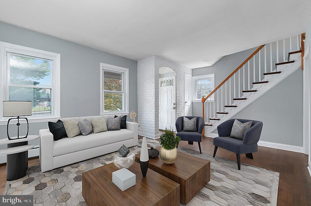 Stunning townhome looking for it's perfect tenant! Move right into this spacious 3 bedroom, 2 bath beauty of a home featuring hardwood floors throughout, stainless steel appliances, breakfast bar and a fully finished basement with separate laundry area. 3 generously sized bedrooms and a full bath occupy the upper level. Pets are case-by-case. Parking pad in rear - never worry about parking! Submit your application today and welcome home!