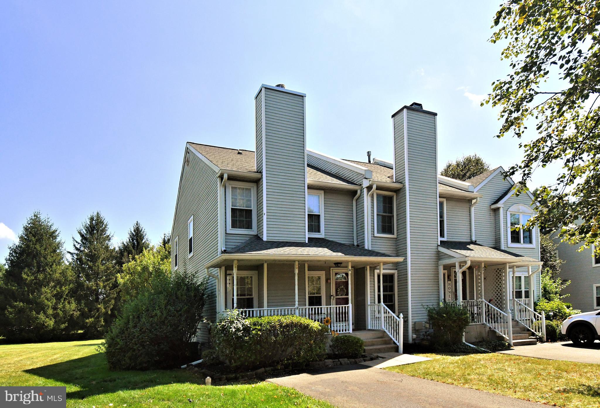 Lovingly maintained and improved 3 BR 2.5 bath end-unit townhome in the highly desired Kirkwood community in Newtown township. The welcoming entry greets you with a quaint covered front porch and entry door with circle top glass that leads to the great room featuring a wood burning fireplace and beautiful wide planked hardwood floors. The dining area leads to a sunny eat-in kitchen with ceramic tile flooring, an abundance of oak cabinetry, CT backsplash, replacement Whirlpool stainless steel appliances including a gas 5 burner range/oven, microwave and dishwasher. SS sink, beveled edge counter tops, recessed lighting and a spacious breakfast room with chair rail and sliding glass doors that leads to a beautifully refurbished paver patio surrounded by a maintenance free fence with gate. Perfect for family fun and for entertaining larger gatherings. Gorgeous rear view oriented towards the open space featuring sprawling grass fields and framed in mature pine trees. Completing this level is a conveniently located powder room and a double coat closet. The second floor is highlighted by a spacious main bedroom with two windows, large closet, ceiling fan and entry into the private full bath with clear glass shower enclosure and vanity. The second bedroom features crown molding, double closet, ceiling fan and w/w carpeting. The third bedroom has two corner windows, ceiling fan, double closet and w/w carpeting. All bedrooms are bright and cheerful and enjoy pretty views. Completing this floor is a full hall bath with shower over the tub, double hall closet and a pull-down staircase to access the attic storage area. The lower level features a wonderful family room in the finished basement with recessed lighting, 6 panel doors and w/w carpeting. There is also a laundry area with oversized laundry tub and plenty of additional storage. Additional features include newer gas heater and central A/C ( 2022), newer 40-gallon gas hot water heater (2024), sump pump w/battery back-up and recent H/W floors on main level. Attached wall speakers in LR, refrigerator, washer and recently installed dryer are included. Convenient location near major routes, parks, shopping and fine dining. Association amenities include tennis courts and playground. Be sure to put this on your must-see list!