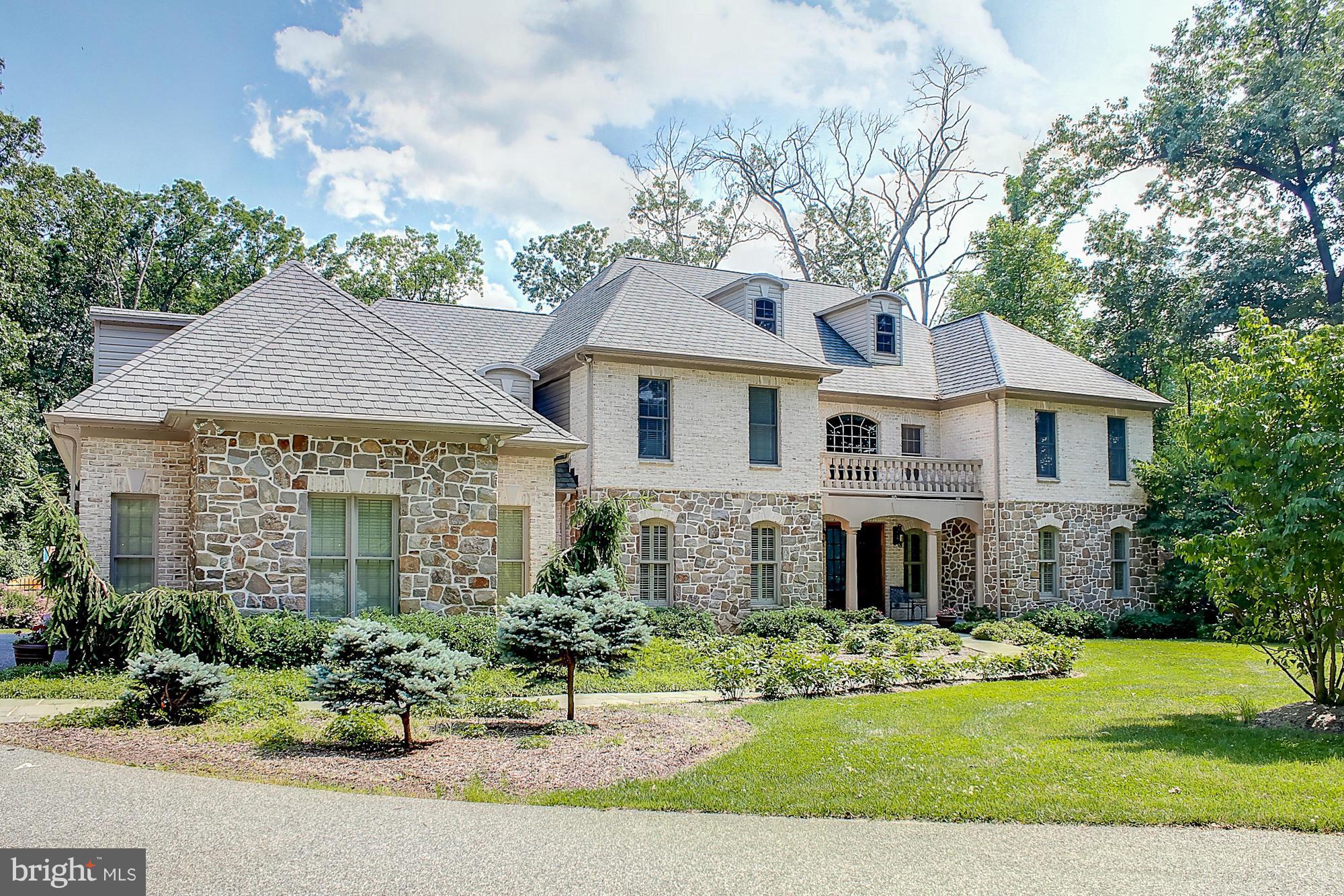 Stone French Country home exudes quality craftsmanship with a flr plan for today's lifestyle. Extensive millwork, HW flrs,high ceilings,huge customSS viking kit w 2granite islands, lg rm sizes,Lavish MBR&BAw/2 walk-ins,windows w plantation shutters throughout 7,000+sq. ft. of liv space.Open kit/Brkfst& 1 1/2story family rm w a Butler stone FP will warm the hearts of all*2+fenced Ac,pool,sport ct