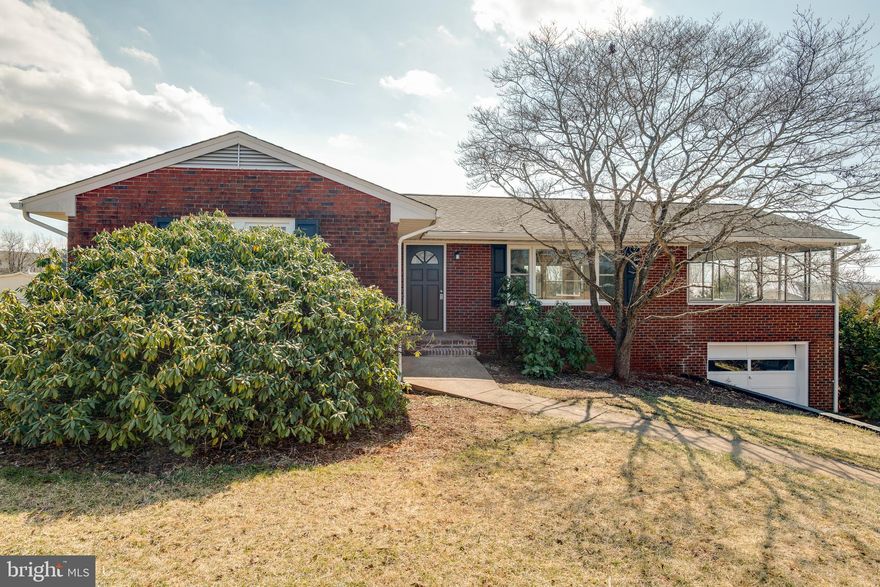 Completely Renovated!  Welcome home to this delightful brick rambler.  The open floor plan is perfect for gatherings.  Kitchen has new cabinets, stainless appliances and granite countertops.  Large, enclosed porch with beautiful views located off of the kitchen.  Four bedrooms and two full bathrooms.  Full finished basement with large recreation room that offers lovely built-ins and boast French doors that go out to a concrete patio for outdoor entertaining.  The finished basement offers a full bathroom and a fourth bedroom.  The upgrades include - new roof, new windows, new plumbing and hot water heater, new flooring and fresh paint throughout the home.