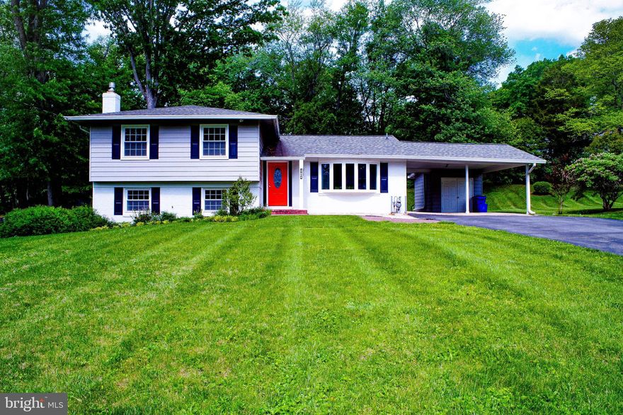 Fantastic renovations throughout, Large 4-level split model.  4 bedrooms on upper level.  Wood floors on main and upper level.  Open concept on main level with huge remodeled and expanded kitchen.  Newer stainless steel appliances, granite countertops, Large kitchen breakfast bar/island.  double sink, lots of storage space, Large pantry cabinets.  Lots of natural light.  Remodeled bathrooms throughout.  5th bedroom and 3rd full bath on basement level with separate entrance, great for in-laws, extended family, guests. Large carport offers flexibility, attached storage shed, additional concrete flooring.  Driveway is 2-cars wide and can accommodate up to 8 cars.  Mature landscaping, beautiful yard.  Bonus rear sunroom is enclosed and can be a potential 6th bedroom or second family room or home office, and has separate entrance also!  Beautiful and mature landscaping throughout the yard.