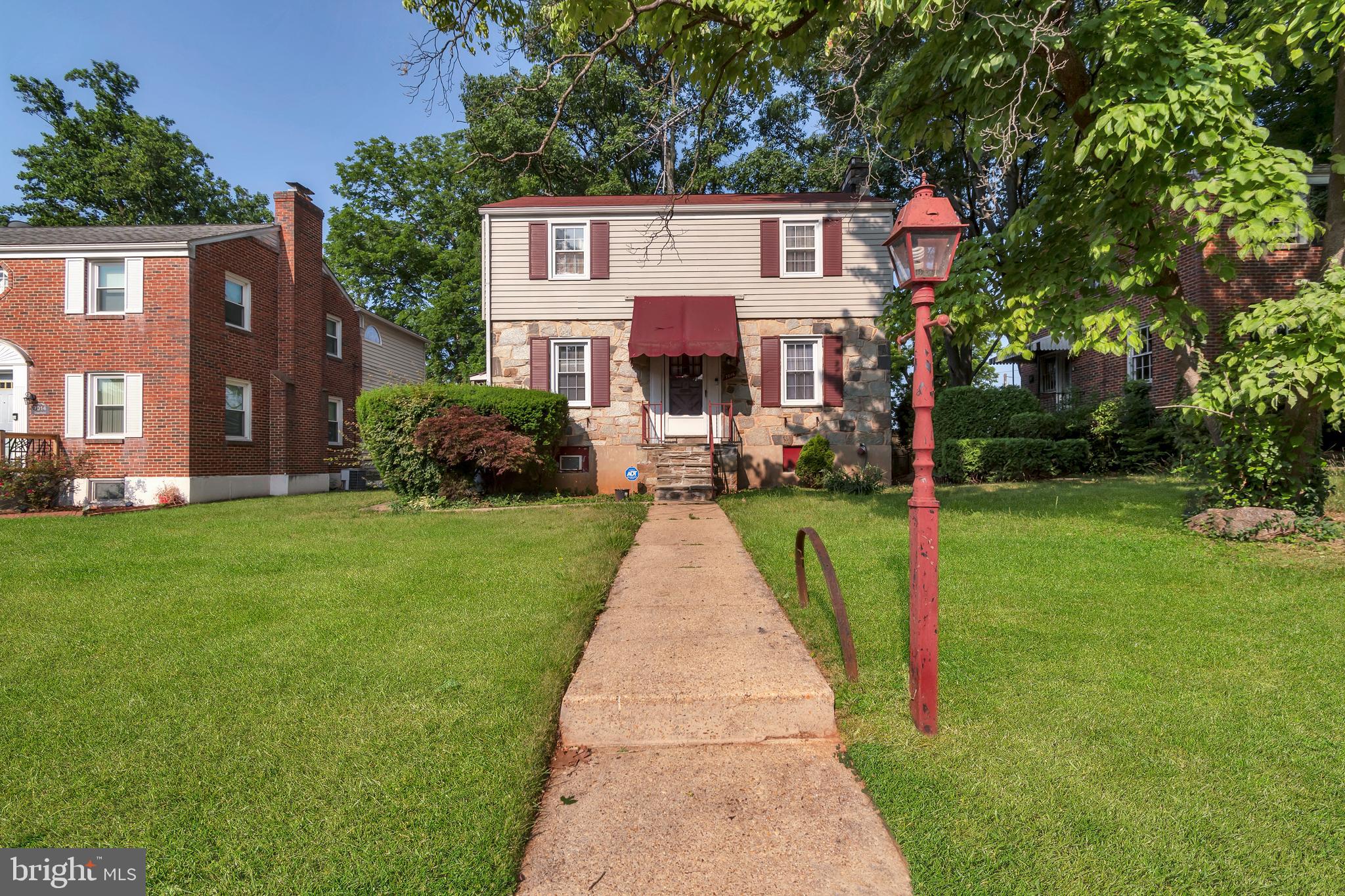 Come see this charming stone colonial home located in Colonial Village. With 3 bedrooms and 1.5 baths, this lovely home boasts beautiful hardwood floors throughout. Featuring some appliances, a separate dining room, and a spacious living room with a cozy wood-burning fireplace, it's perfect for entertaining. The finished basement with outside access is an added bonus. The landscaped and level-fenced lot is perfect for outdoor activities, while the large screened porch offers a relaxing spot to enjoy the nice breezes. Don't miss out on this wonderful home, and make it your own.