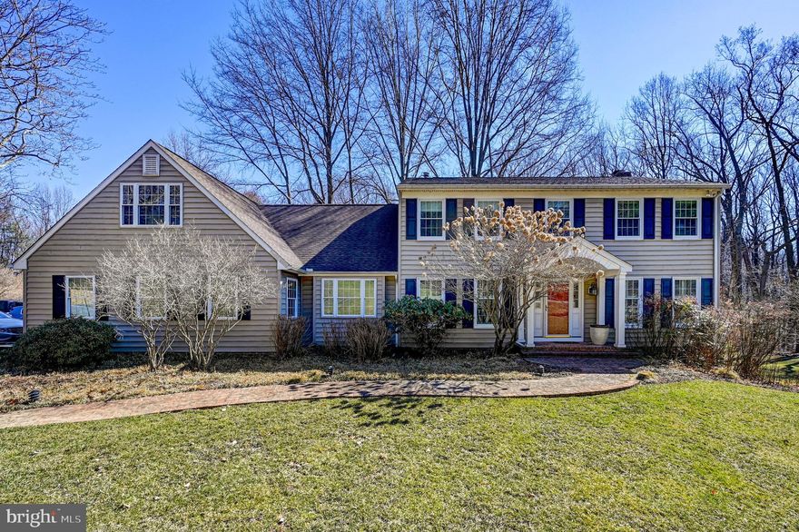 Welcome to timeless elegance in the heart of the coveted Falls Road Corridor.  Nestled on a tranquil cul-de-sac with access to Oregon Ridge Park, this magnificent, and pristine architecturally expanded four bedroom, three full and one half bath center hall Colonial sits on a beautifully landscaped and private 2-acre lot on picturesque Dellwood Court.  Perfection shines throughout, starting with the gleaming hardwood floors on both the main and upper levels. The inviting floor plan is thoughtfully designed for both everyday comfort and effortless entertaining. The heart of the home is truly the expansive chef’s kitchen; complete with high-end appliances, gas cooking, double ovens, a warming drawer, spacious island and breakfast bar.  This gourmet space seamlessly flows into a sunlit breakfast room and cozy family room featuring a wood-burning fireplace flanked by custom built-ins and French doors leading to the formal living room. The main level also offers a formal dining room, a spacious mudroom, a dedicated laundry room, and a versatile home office or bonus room.  The upstairs features four generously sized bedrooms including the primary suite with dressing area and en-suite bath.  A brand new spacious full bath is just down the hall along with the fourth oversized bedroom that includes a separate sitting area, offering flexible space for guests or extended family.  The finished lower level features new luxury vinyl plank flooring, a large recreation area perfectly prepped for a wood stove, a third full bath, utility room, cedar closet, and ample storage space.  Step outside from the main floor to enjoy the expansive composite deck overlooking the serene gardens, and a brick patio from the walk out lower level. Both offer an idyllic setting for outdoor entertaining or peaceful mornings surrounded by nature. Additional features include a three-car garage and an additional storage space for lawn tools and furniture.  This exceptional home truly offers the best of both privacy and convenience in one of Baltimore County’s most desirable locations.