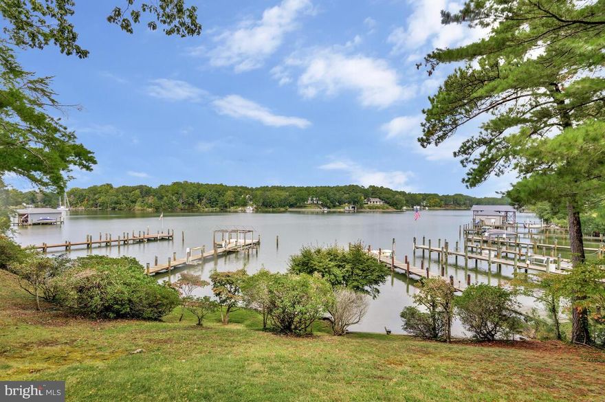 Waterfront on Mills Creek

Welcome to a truly unique opportunity to create your dream compound! This waterfront ranch is positioned on a triple lot of 1.3-acres with direct access to Mills Creek, offering 170' of waterfront views and a peaceful setting. While the home's interior is a blank canvas awaiting your vision, its incredible bones and unparalleled location provide the perfect foundation for a stunning modern transformation.

Inside, the home features two bedrooms and two bathrooms, with an open-concept living area that centers around a cozy fireplace. The layout is ready to be reimagined to fit a contemporary lifestyle. Imagine redesigning the kitchen, updating the bathrooms, and creating a master suite that fully captures the beautiful water views.

The property includes a one-car attached garage and a separate, oversized one-car detached garage, complete with a storage loft and workshop—a perfect space for projects while you renovate the main house.

Outdoors, the value of this property truly shines. Enjoy stunning sunsets from the covered patio or head down to your private pier, equipped with electricity, water, and two boat lifts. The deep water at the end of the pier allows for easy boating and fishing right from your backyard.  

As an added bonus, this sale includes not only the main triple lot but also a separate, triple lot across the street. This provides an extraordinary amount of space for a new owner to explore and expand. The potential is immense—you could build an additional garage, or potentially a guest house, or second full-sized home.

This is more than just a home,  it's a rare chance to acquire a vast amount of waterfront property with unparalleled development potential. Don't miss this opportunity to own and fully customize your entire waterfront compound.
