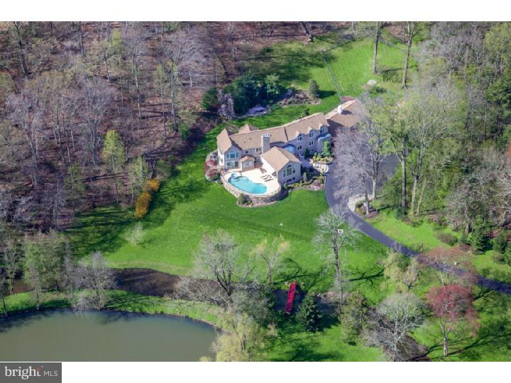 Once in a great while, a magnificent property like this, comes on the market. The nearly 20 gorgeous acres is adorned with mature trees and woodlands, open manicured lawns, wooded trails, and the pi ce de r sistance, historic "DOVE LAKE". Another outstanding feature, steeped in history, is the famous Mill Creek, running the entire length of the property, terminating with a wonderful waterfall/dam. Ideally positioned to take advantage of the breathtaking views and natural features this property has to offer, sits a stunning 12,000+- sq. ft. Custom French Contemporary home, complete with three glorious levels of luxurious living. First and second floor master suites accompanied by large windows, with captivating views, above grade finished lower level with restaurant style bar, nearly new heat and air conditioning, indoor resistance pool, elevated in ground pool overlooking the lawns, creek and lake. Top of the line finishing's, garage parking for six cars complete this one of a kind offering. A portion of the property is under a conservation easement, protecting these rare natural resources for all eternity.