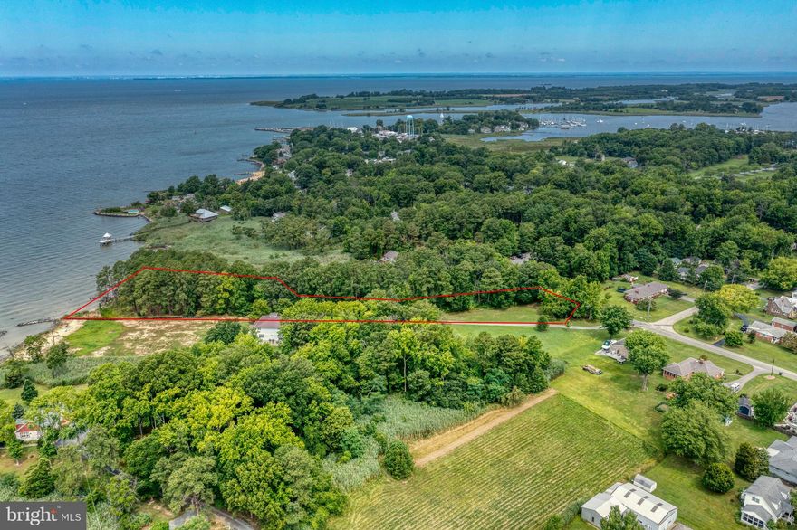 A special opportunity for in-town privacy on the water!  Serene entrance from Bayside Ave and a private sandy beach on the Chesapeake Bay, over 150 feet of waterfront! Survey showing buildable area available; one of the last buildable waterfront lots in Rock Hall.  The perfect opportunity for a beautiful bay-front home. Walking distance to Rock Hall's best waterfront dining, and a short distance to downtown Main St and ample marinas.