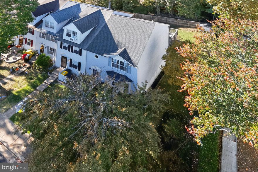 Welcome to 332 Carronade Way, an inviting end-unit townhome ideally located in highly desirable Arnold on the Broadneck Peninsula, just minutes from downtown Annapolis. This conveniently situated 3-bedroom, 2.5-bath residence offers over 1,900 square feet of bright, comfortable living space. The main level features an open living room filled with natural light, a separate dining area, and a spacious kitchen with ample cabinetry and counter space—perfect for both everyday living and entertaining. There is also a large deck on this level, perfect for enjoying the outdoors or a BBQ gathering. Upstairs, you’ll find three peaceful bedrooms, including a large primary suite with an updated ensuite bath, while the two guest rooms share a refreshed hall bathroom. The lower-level family room opens directly to a deck and a fully fenced backyard, creating an effortless indoor-outdoor flow ideal for relaxation or play. Enjoy the added privacy of an end unit with extra windows and a tree-lined backdrop, along with the convenience of two assigned parking spaces and ample guest parking. Situated within the sought-after Broadneck school district and close to shopping, recreation, commuter routes, and Chesapeake Bay waterfronts, this home offers the perfect blend of comfort, location, and lifestyle.