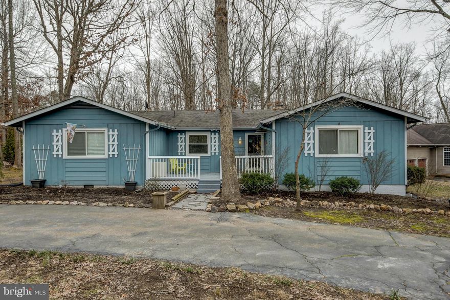 PRICED BELOW TAX ASSESSMENT!  Wonderful corner lot with ample parking.  Lg Ramber w/Lg Rooms! Paved circ dr,  Kitchen w/skylites, Lg front patio porch!  Sought after gated community w/many amenities! Seller states roof replaced 2006, windows and heating system replaced in 2009 dates approx. Seller reduced price to accommodate for improvements needed to home.  NEW PRICE!  Won't last long.