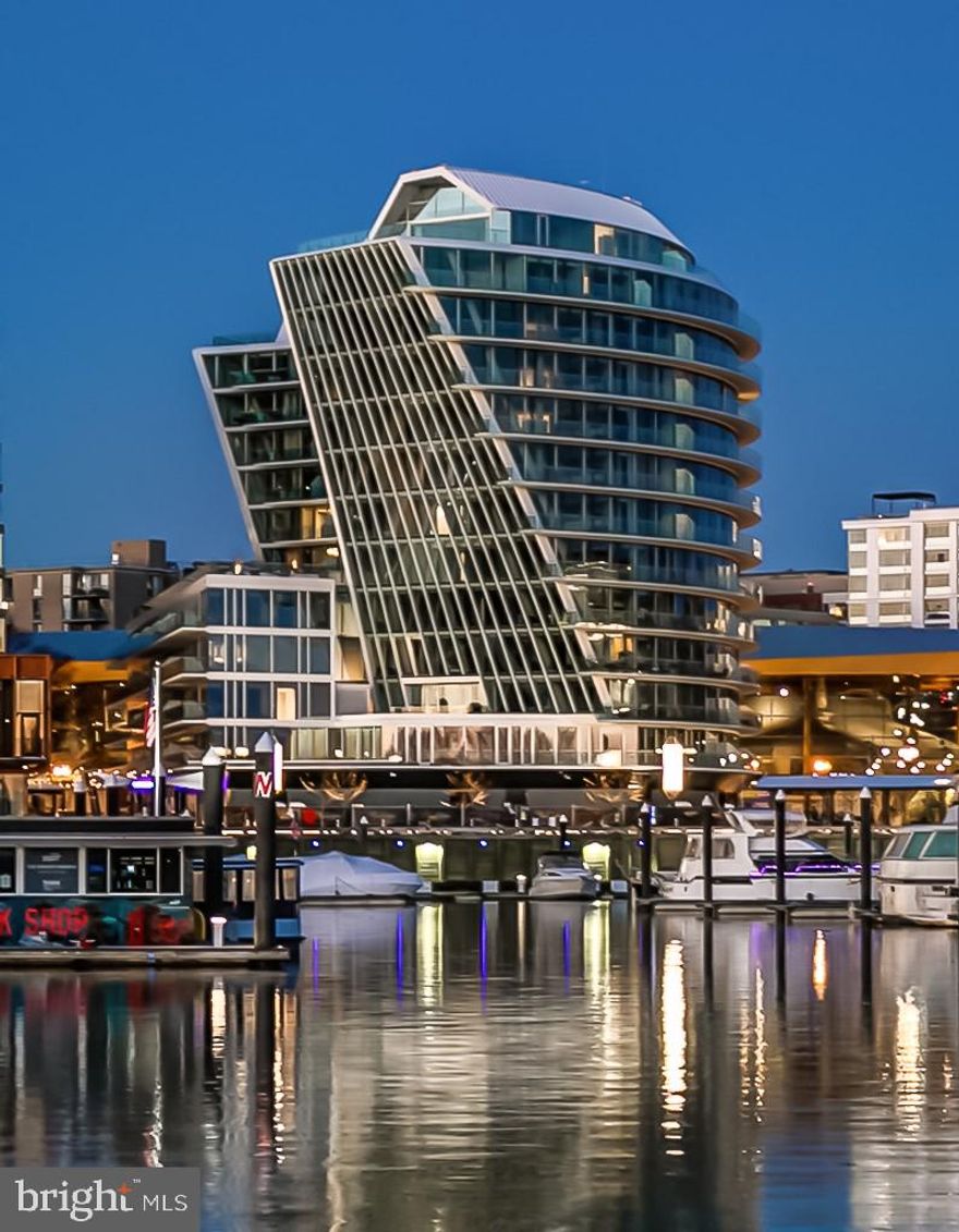 1001 is the last residence remaining in this direct waterfront tier. A spacious residence featuring sweeping water views from the glass on three sides including Amaris' iconic, floor-to-ceiling curved, cold‑warped glass wall throughout. This generous residence includes a semi-private elevator, abundant closets, a gourmet kitchen with custom Italian kitchen cabinetry and hardware by Stevali with under-cabinet lighting, premium Thermador and Bosch appliances, and a honed marble kitchen island. The primary suite with separate primary bathrooms offers the perfect setting to soak in the sunsets. At every turn, the floor plan and design of residence 1001 create an immersive, welcoming sense of home. At Amaris, amenity spaces exist to invigorate, elevate, and create a nourishing sense of wellness. Inside, an indoor, two-lane, saltwater pool, spa, and sauna spill into a spacious fitness area with a bridge connecting the residents’ lounge and adjoining screening room. Outside, a waterfront terrace with breathtaking views and a grilling area gives way to an immersive space with inspiring views. Amaris is designed by the late, world-renowned architect Rafael Viñoly with interiors by celebrated architect Thomas Juul-Hansen delivering inspiring spaces, breathtaking views, and replenishing amenities in a location unlike any other, at The Wharf. The Wharf is a mile-long waterfront neighborhood offering events and activities, local, chef-owned restaurants, boutique shops, expansive promenades, piers, and over 17.5 acres of green and community spaces.