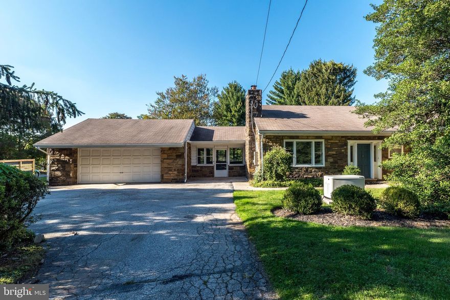 Conveniently located to all major routes and just a few minutes from the lovely town of Wayne, this mid century solid stone rancher is the perfect place to call home. Enter the circular driveway to your front entry attached garage. One floor living at its best with a bright Living Room with a central stone fireplace, Dining Room, Eat-In Kitchen, Master Bedroom with en-suite half bath, 2 other nice sized bedrooms and a full hall bath. A sunny enclosed Breezeway leads you from the kitchen to the garage. The Lower Level is finished with nice open living space, easy access washer/dryer and a convenient full bath. Relax in the screened in back porch which opens up to a private back yard