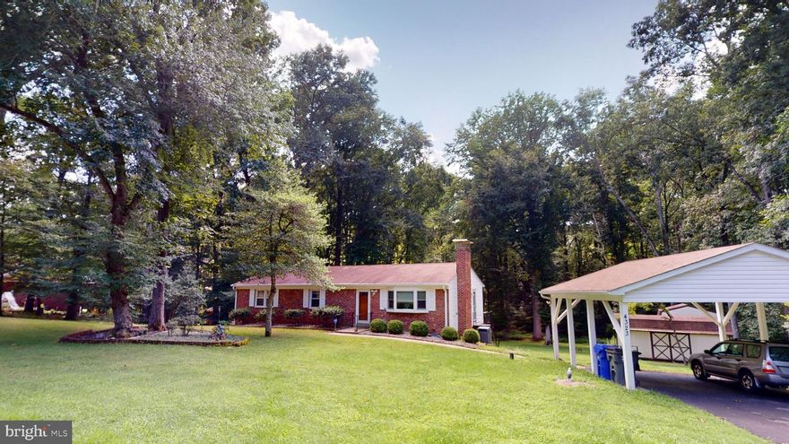 Welcome to the charming Columbia Park Subdivision in Pomfret, where you'll find this inviting brick rambler nestled on a generous 1.88-acre lot. This timeless home exudes a classic appeal while offering modern comforts.
As you approach the property, you'll be greeted by a meticulously landscaped yard adorned with vibrant plantings, and mature trees. The serene ambiance and natural beauty provide a peaceful retreat from the outside world.
Step inside the home, and you'll be captivated by its warm and welcoming atmosphere. The spacious living room has a large bay window that floods the space with natural light, creating an inviting and cozy environment. 
The kitchen, located adjacent to the dining room, features ample cabinetry and counter space, allowing for easy meal preparation and storage. With its functional layout, and room for a table, the kitchen becomes the heart of the home, perfect for culinary adventures and gathering with loved ones.
The primary bedroom offers a comfortable sanctuary, while the additional three bedrooms provide versatile space for a growing family, guests, or even a home office. The two full bathrooms, (one on each floor) thoughtfully designed, offer convenience and comfort for the whole household.
The home's full basement provides endless possibilities, whether you envision it as a recreation room, a home gym, craft room, or in-home studio. The choice is yours, as it presents a versatile space that can be tailored to suit your unique needs. The brick fireplace, complete with a pellet stove insert, adds both aesthetic charm and a practical heating option during colder months. There is also a large, enclosed storage room which contains a whole house water filter system. This room can easily hold all your extra items and supplies; and keep them out of site of the living spaces. 
One of the highlights of this property is the expansive back deck, an idyllic spot for outdoor entertaining, barbecues, or simply relaxing and enjoying the tranquil surroundings. The vast yard offers plenty of room for outdoor activities and recreational pursuits, making it a perfect setting for social gatherings or hobbies.
Additional amenities include two sheds, perfect for storing tools, equipment, or gardening supplies, as well as a detached carport, providing covered parking and protection for your vehicles.
A notable advantage of this property is the absence of an HOA, allowing you the freedom to personalize and enhance your living space according to your preferences.
This home offers a serene retreat from the hustle and bustle of city life while still providing convenient access to urban amenities. It’s located within easy commute distance to DC Metro area, several military bases, shopping, restaurants, parks, and much more. With its ideal location, peaceful surroundings, and irresistible features, this home is a truly exceptional find.