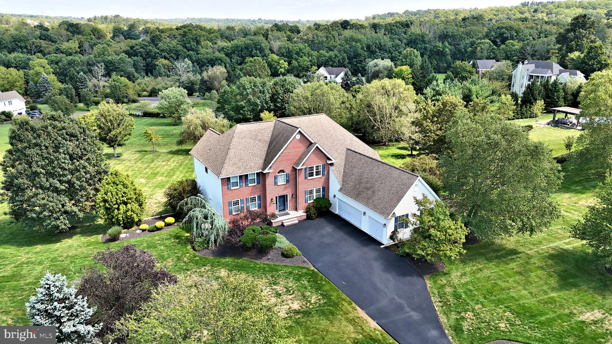 Located in one of Northampton Township s most sought after communities sits the spectacular and spacious custom built home. Situated perfectly on a gorgeous 2 acre parcel, this fabulous property is being offered for the very first time, and has been lovingly maintained and upgraded both inside and out. The classic brick front is timeless and beckons you from the moment you arrive. Entering to an open two story foyer you will be greeted by gleaming hardwood floors. To the left is the elegant formal living room, to the right the formal dining room. A two story family room with brick surround gas fireplace is directly off the gourmet kitchen and large breakfast area. The kitchen has been updated with stainless steel appliances ( 2024 ), has a center island with seating for 4, two great pantries, work station, and convenient back staircase. Off the breakfast area is a large 30' x 17' maintenance free deck with gorgeous long distance views. A home office/library, spacious mud room, laundry room and powder room complete the main floor. The upper level features a spacious and elegant Primary Suite, with large sitting room, two nicely sized walk- in closets. The luxurious Primary Bath is outfitted with gleaming white tile, has a large soaking tub, double vanity and large linen closet. Three additional bright and airy bedrooms, all with spacious closets, flank the large upper hall and complete the upper level. The huge finished lower level features walk out doors to the spectacular paver patio, additional windows providing maximum daylight, gas fireplace with tile surround, entertainment and game areas, and large bedroom with full bath. There is also ample unfinished storage space. The grounds, impeccable landscaping, and exterior features are icing on the cake for this inviting property. Additional features of this wonderful home include a 3 car garage, new asphalt driveway, whole house backup generator, 2 zone HVAC ( new in 2023), newer windows and doors, newer roof, security system, and much more. Worthington Mill Estates is an exclusive, beautiful, quiet community of just 22 custom homes, with no HOA! Located just minutes from Newtown, Richboro, New Hope and Tyler State Park in the heart of the Council Rock School District. This turn-key move-in condition property may be the best new opportunity on the market today; come see for yourself!***Showings start Sunday, September 22 at the Open House Noon - 3:00PM.***