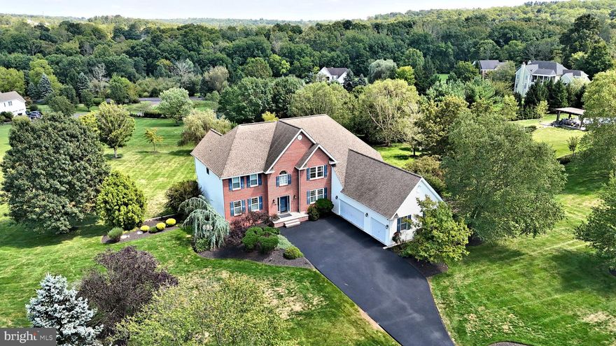 Located in one of Northampton Township s most sought after communities sits the spectacular and spacious custom built home. Situated perfectly on a gorgeous 2 acre parcel, this fabulous property is being offered for the very first time, and has been lovingly maintained and upgraded both inside and out. The classic brick front is timeless and beckons you from the moment you arrive.  Entering to an open two story foyer you will be greeted by gleaming hardwood floors. To the left is the elegant formal living room,  to the right the formal dining room.  A two story family room with brick surround gas fireplace is directly off the gourmet kitchen and large breakfast area. The kitchen has been updated with stainless steel appliances ( 2024 ), has a center island with seating for 4, two great pantries, work station, and convenient back staircase.  Off the breakfast area is a large 30' x 17' maintenance free deck with gorgeous long distance views.  A home office/library,  spacious mud room, laundry room and powder room complete the main floor.  The upper level features a spacious and elegant Primary Suite, with large sitting room, two nicely sized walk- in closets. The luxurious Primary Bath is outfitted with gleaming white tile,  has a large soaking tub, double vanity and large linen closet. Three additional bright and airy bedrooms, all with spacious closets, flank the large upper hall and complete the upper level. The huge finished lower level features walk out doors to the spectacular paver patio, additional windows providing maximum daylight, gas fireplace with tile surround, entertainment and game areas, and large bedroom with full bath. There is also ample unfinished storage space. The grounds, impeccable landscaping, and exterior features are icing on the cake for this inviting property.  Additional features of this wonderful home include a 3 car garage, new asphalt driveway, whole house backup generator, 2 zone HVAC ( new in 2023),  newer windows and doors, newer roof, security system,  and much more. Worthington Mill Estates is an exclusive, beautiful, quiet community of just 22 custom homes, with no HOA! Located just minutes from Newtown, Richboro, New Hope and Tyler State Park in the heart of the Council Rock School District. This turn-key move-in condition property may be the best new opportunity on the market today; come see for yourself!***Showings start Sunday, September 22 at the Open House Noon - 3:00PM.***
