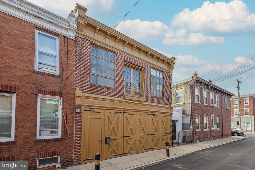 Unique Live-Work Opportunity in the Heart of Port Richmond! Welcome to 3107 Tilton Street — a versatile property offering the perfect combination of workspace and living space. The oversized one-car garage is ideal for a workshop, studio, or contractor’s base of operations and includes a separate office area for added functionality. Upstairs, you’ll find a bright and open efficiency apartment featuring stylish LVP flooring, exposed brick walls, and double doors to a Juliet balcony that let in abundant natural light. The apartment includes a kitchenette, full bathroom, and in-unit washer and dryer, providing everything you need for comfortable city living. Located on a quiet block in desirable Port Richmond, this property offers easy access to I-95, local cafes, shopping, and neighborhood favorites. Whether you’re an investor, small business owner, or someone seeking a unique live-work setup, 3107 Tilton Street is a must-see!