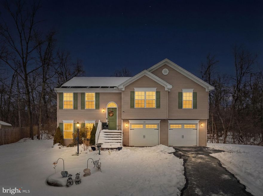 Welcome home to this charming split foyer in a quiet neighborhood with convenient access to Routes 9 and 11, along with easy commuting via I-81.  
Step inside to a stylishly updated interior, featuring board-and-batten molding, wallpaper and accent walls. The spacious living room flows into the kitchen and dining area, creating an open and airy feel. A cabinet-packed kitchen is the heart of the home, with a center island providing additional seating and storage, and stainless steel appliances that are just two years old.
Main-level bedrooms are generously sized and share a hall bath, while the primary suite features a walk-in closet and private bath.
The lower level includes a fourth bedroom and full bath, providing privacy and additional living space. A laundry area and additional storage complete the lower level. 
An oversized two-car garage provides plenty of room for vehicles, storage, and a work area. Enjoy the deck and wooded backyard that backs to 18 acres of vacant land, offering privacy and peaceful views.