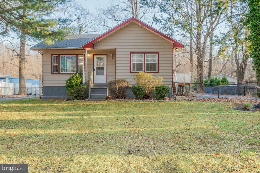 An entertainers dream! Beautiful cottage like setting on an oversized yard with a wrap around deck, electric run out to the back of the yard for firepit/entertaining area and ample 360 degree parking.  Renovated kitchen has plenty of counter space and storage. Extra deep tub with stone surround in the main level bathroom off the master bedroom & full bath and 2 bedrooms in the basement. Easy access to the water as well as major highways without the sounds of the city! 35 year roof installed in 2017. New HVAC inside and out installed summer of 2016