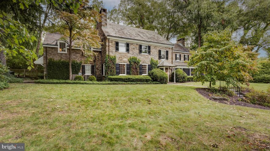 Elegant, well-maintained, three-story center-hall stone Colonial located on one of the most coveted, tree-lined blocks in West Mount Airy, Philadelphia. Walking distance to the Wissahickon Valley’s woodland trails, Weaver’s Way food co-op, neighborhood coffee shop, playground, commuter rail, and more, this is the one you’ve been waiting for!

 

With total square footage just under 5,000, it’s not too small but not too big. This lovely home sits on a lightly-traveled, tree-lined street and offers 5+ bedrooms and 3-½ baths with the potential of a fourth full bath  on the third floor.  Built in 1929, the house features the fine craftsmanship of the past but offers modern features like an attached three-car garage, two-zone central air conditioning, screened porch, eat-in kitchen, and good-sized closets. From the street, walk up the lovely stone walkway to the front door that opens to a spacious entry hall with coat closet, powder room, entrance to the finished basement, and charming Dutch door to the backyard and terrace. To the right of the foyer is the well-proportioned living room with wood-burning fireplace, built-in bookcases and case work; a door to an appealing screened porch; and beautiful random-width oak floors. Beyond the living room is the family room with bookcases, another fireplace, and space enough for everyone to relax and watch the latest blockbuster series on TV. To the left of the foyer is the beautiful light-filled dining room--with its own fireplace and built-in storage--that will easily hold your biggest celebrations. Through the dining room is the eat-in kitchen with two sinks, four-burner gas cooktop, Sub Zero refrigerator, and soapstone counters. The back staircase, another entrance to the basement, and a back door exit that leads to the garage make the kitchen the hub of the house. 

 

Up the elegant turned staircase with its sunny landing, you reach the smartly-designed second floor. Every bedroom is spacious, every closet is workable, and each has built-in bookcases. To the right at the top of the stairs is the primary suite with its own private bath, two closets (one walk-in), and windows on three sides. To the left from the second-floor landing are the additional bedrooms and hall bath.  At the far end of the second floor is the fourth bedroom with its own bathroom,  and adjacent large office with bookcases and decorative fireplace. The second floor is completed with a laundry closet, storage closet, and hallway to the back staircase that takes you to the third floor. The third floor offers ample storage as well as two rooms and a bathroom that could serve as guest quarters, au pair suite., or office.  The walk-out basement has a large finished space with fireplace and bar, mechanical room, and middle room with exit and window, perfect for gardening or other crafting. Exceptionally well-built, the details throughout will delight. Mature trees and lush understory create a private oasis.