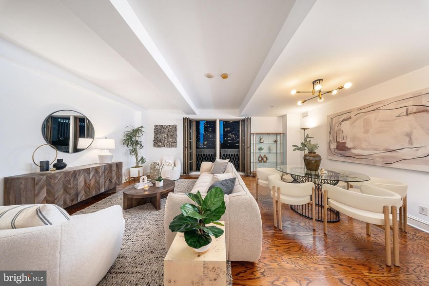 Where can you find a three-bedroom, three-bathroom residence overlooking the Square with parking? At Parc Rittenhouse #908, opportunity meets elegance in one of Philadelphia’s most iconic addresses. This rare, move-in-ready home is perched directly above Rittenhouse Square, with sweeping treetop and sunset views from every room that will make your heart skip, whether it’s your first glance or your hundredth.

From the moment you enter, you're welcomed by a refined open layout ideal for modern city living. The gourmet kitchen, lined with sleek flat-panel cabinetry, granite countertops, and stainless steel appliances, is open to the dining and living room, creating a seamless space for everyday living and effortless entertaining. From the kitchen, your eyes are drawn across warm hardwood floors to floor-to-ceiling French doors that lead to a Juliet balcony, framing iconic views of Rittenhouse Square’s lush canopy and the classic architecture that surrounds it. Whether you’re preparing a meal or sipping wine with friends, the ever-changing landscape of the Square becomes the backdrop to your daily life.

The thoughtful split-bedroom floor plan offers privacy and function, with a tranquil primary suite tucked away on one end, featuring a large walk-in closet and an en-suite bath with dual vanities and an oversized walk-in shower. On the opposite side, two generously sized bedrooms (each with access to their own full bathroom) make this home as flexible as it is beautiful.

And the ultimate luxury? A parking license for one valet garage space is included, an amenity nearly impossible to come by on the Square.

Parc Rittenhouse offers far more than a prestigious address. The newly renovated 7th-floor amenity level feels like an extension of your home: unwind by the outdoor pool and hot tub, lounge in the club room by the fireplace, host a meeting in the boardroom, or recharge in the state-of-the-art fitness center. With 24-hour concierge, pet-friendly policies (with restrictions), and Philadelphia’s top dining, boutiques, and culture just outside your door, #908 isn’t just a home, it’s a lifestyle.