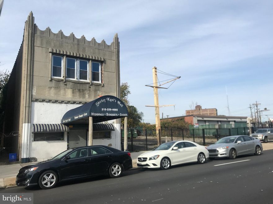 Three Story building in the heart of North Philadelphia, (about 4.1 miles to City Hall).  This property listing covers 3  parcels: 1). The front building - 3824 N. Broad St., used to be a famous banquet hall for weddings, convention, meeting, social gatherings. Featuring double doors entry to open wide banquet hall with very high ceiling  to the top. Stairs up to 2nd floor with an overlook to main banquet floor area. Main floor and 2nd floor extends up to the back building with a  street frontage  2).  3827 Germantown Ave. Two buildings in one with open floor designed to accommodate group(s) of people on each floors. 3). 3826-3830 N. Broad St. - 3 parcels of vacant lot, with gated wire fence that can be used as parking lot up to 20+/- approximately. Or, this lot can be a site for future add-on building subject to City Zoning approval. ALL together, these two buildings plus 3 parcels of lots have a potential for business and other commercial use, subject to City Zoning approval .  2 Buildings (3824 N. Broad and 3827 Germantown Ave. -  square footage combined is 10,422 Sq.Ft. approximately, sitting on lot area of 4,385 Sq.ft.  Vacant lot on 3826-30 N. Broad St. (fully fenced in) is 8,238 Sq.Ft. approximately. (dimension: 72' x 114.42') . These 3 lot parcels is being offered by the Seller as one for your business headquarter. Lots of possibilities for this opportunity.  The location is right on busy North Broad St. near junction of Roosevelt Blvd. Close to subway train station.  15.9 miles approx. (est. 20 mins. drive) to Philadelphia International airport